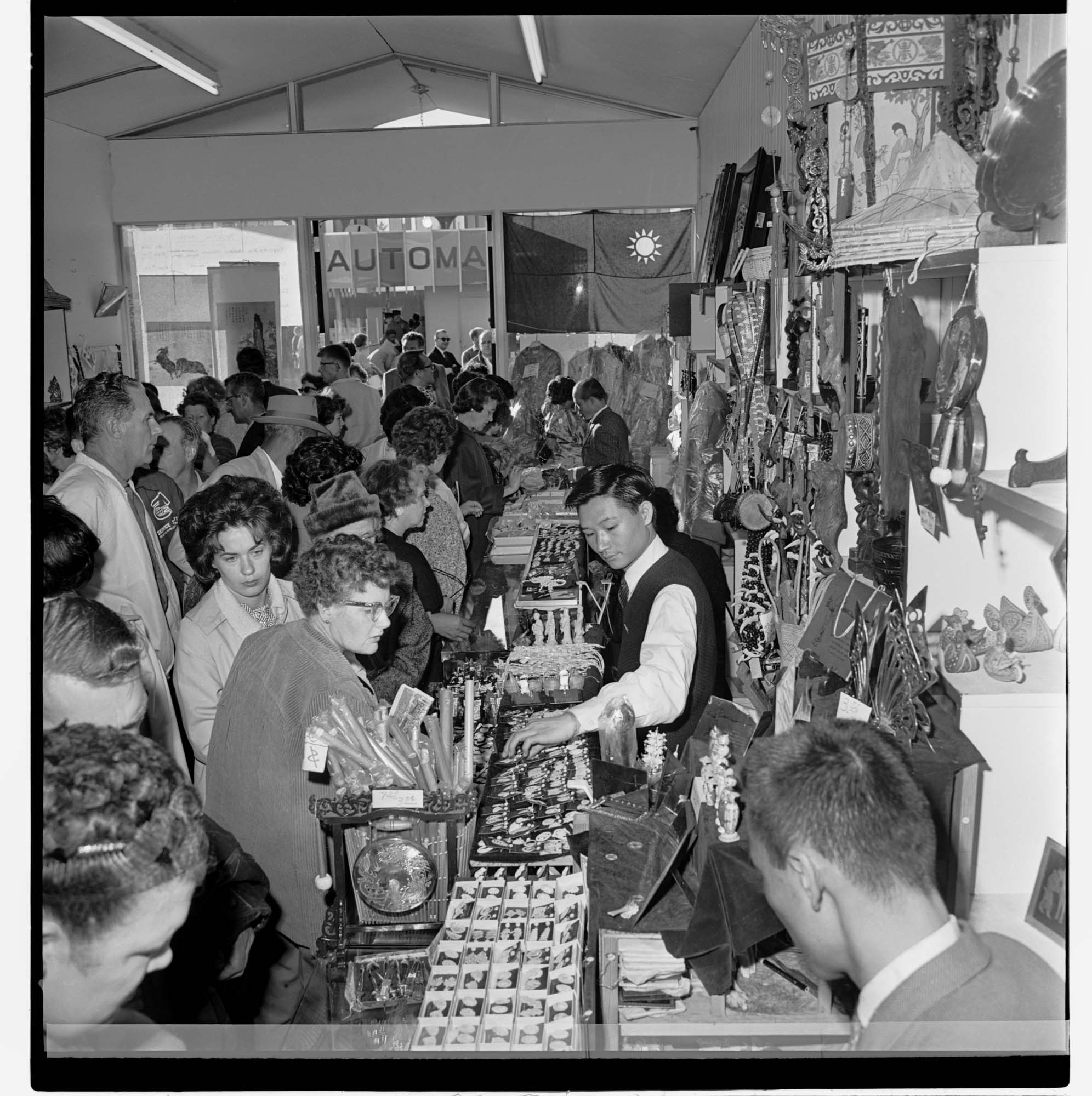 Image of Interior of a souvenir shop filled with fairgoers on closing day, Seattle World's Fair, October 21, 1962