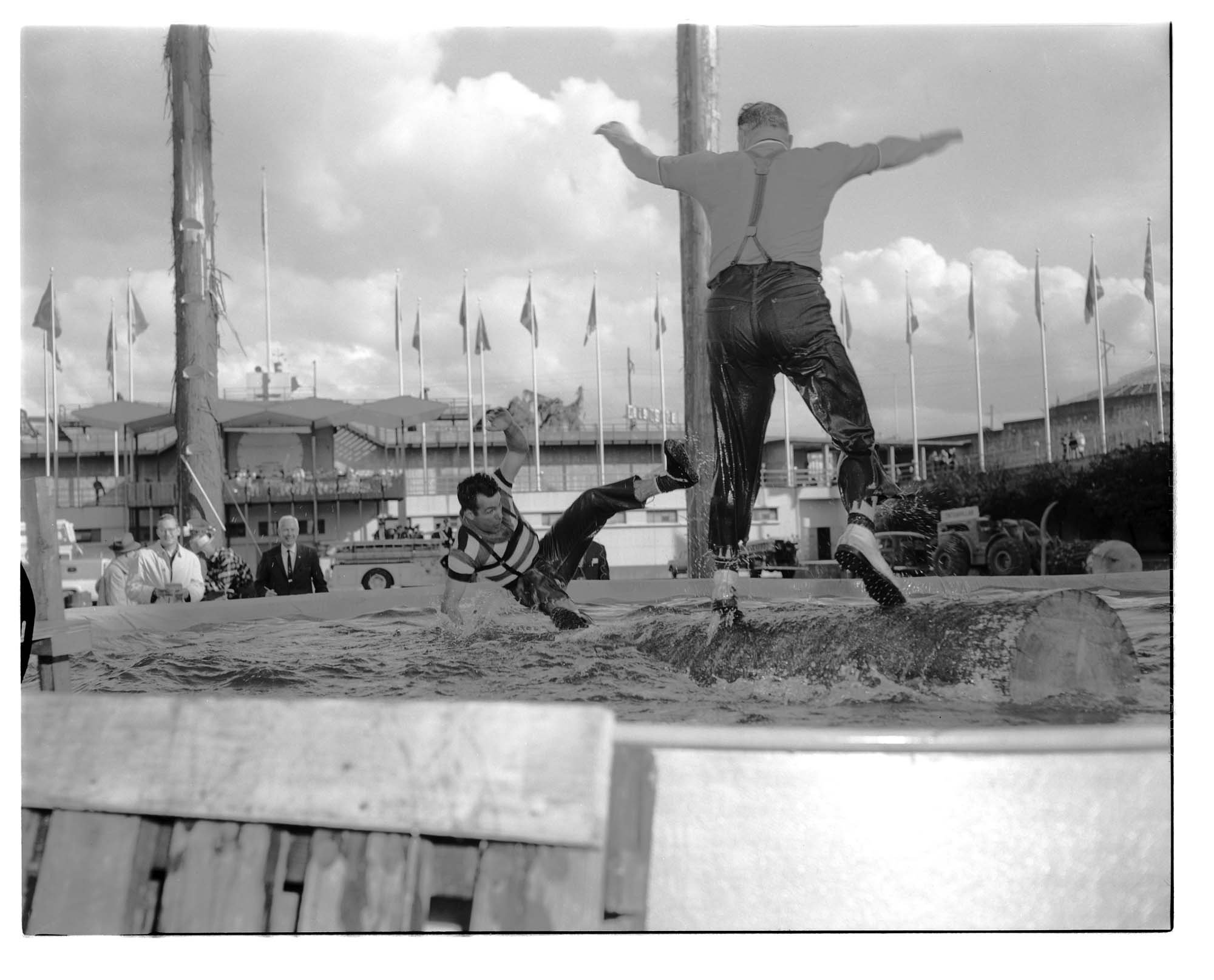 Image of Logrollers at a lumberjack show, Seattle World's Fair, 1962