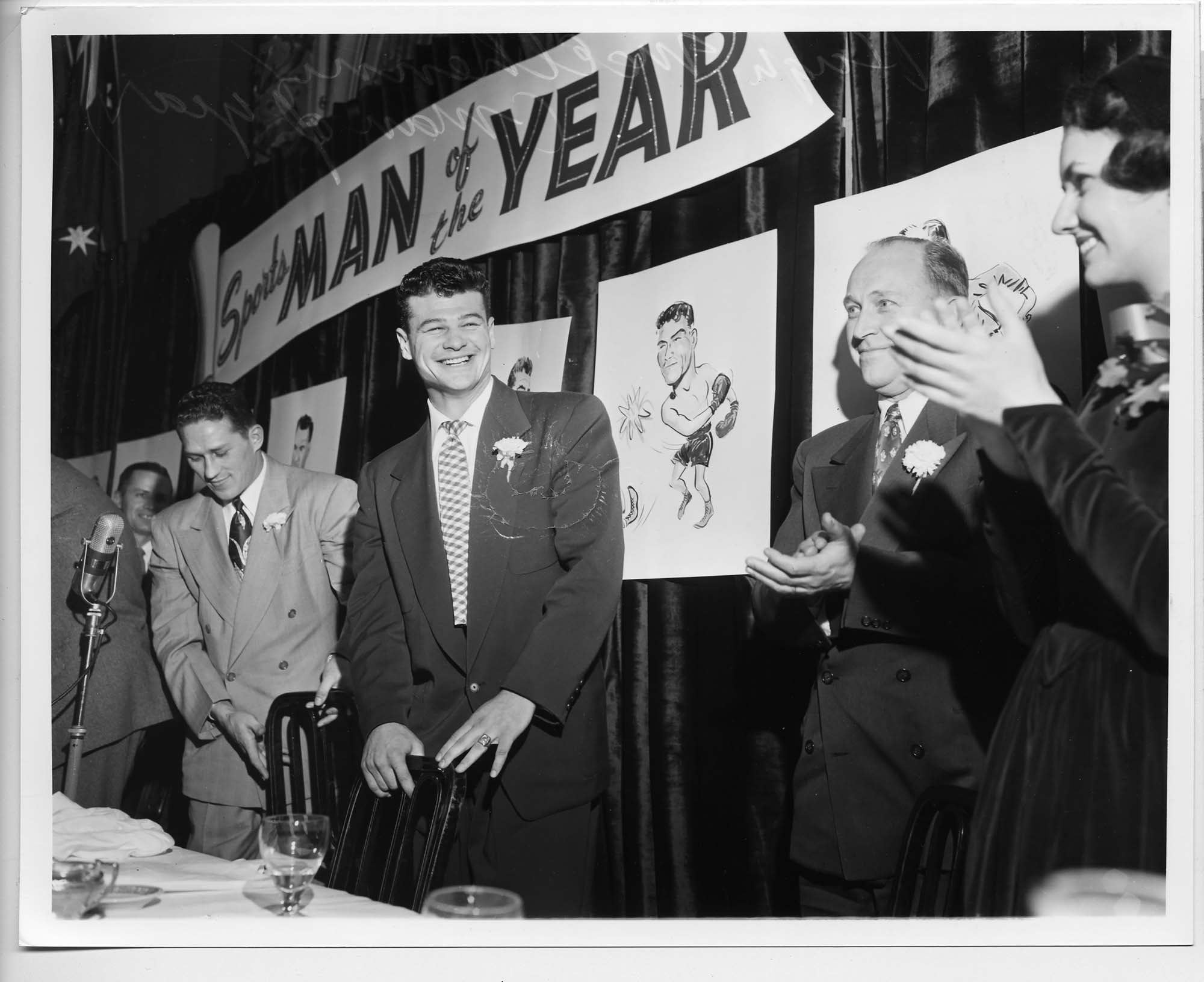 Image of Hugh McElhenny receiving Post-Intelligencer Sportsman of the Year award, probably in Seattle, 1951