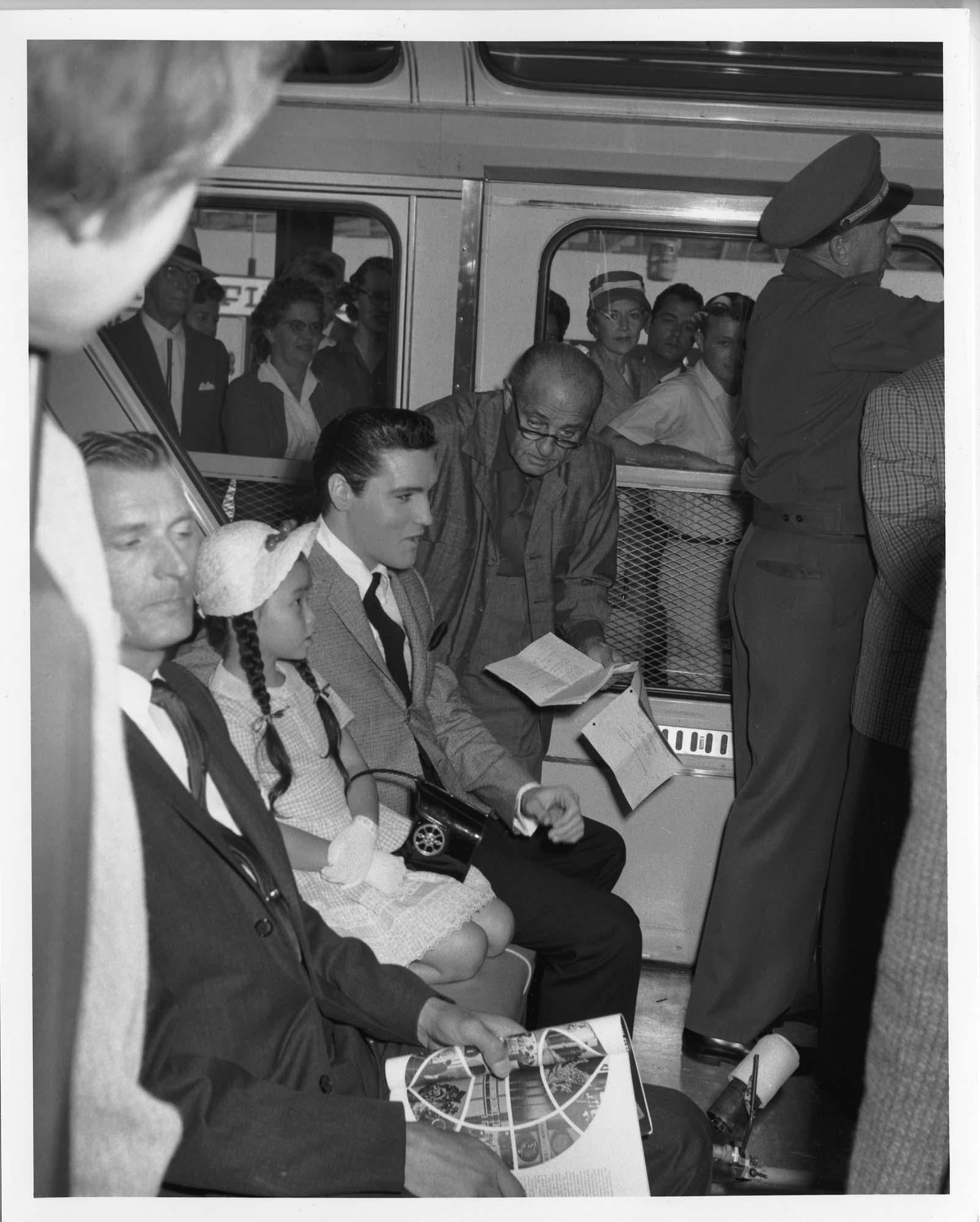 Image of Elvis Presley on the monorail during the World's Fair, Seattle, September 1962