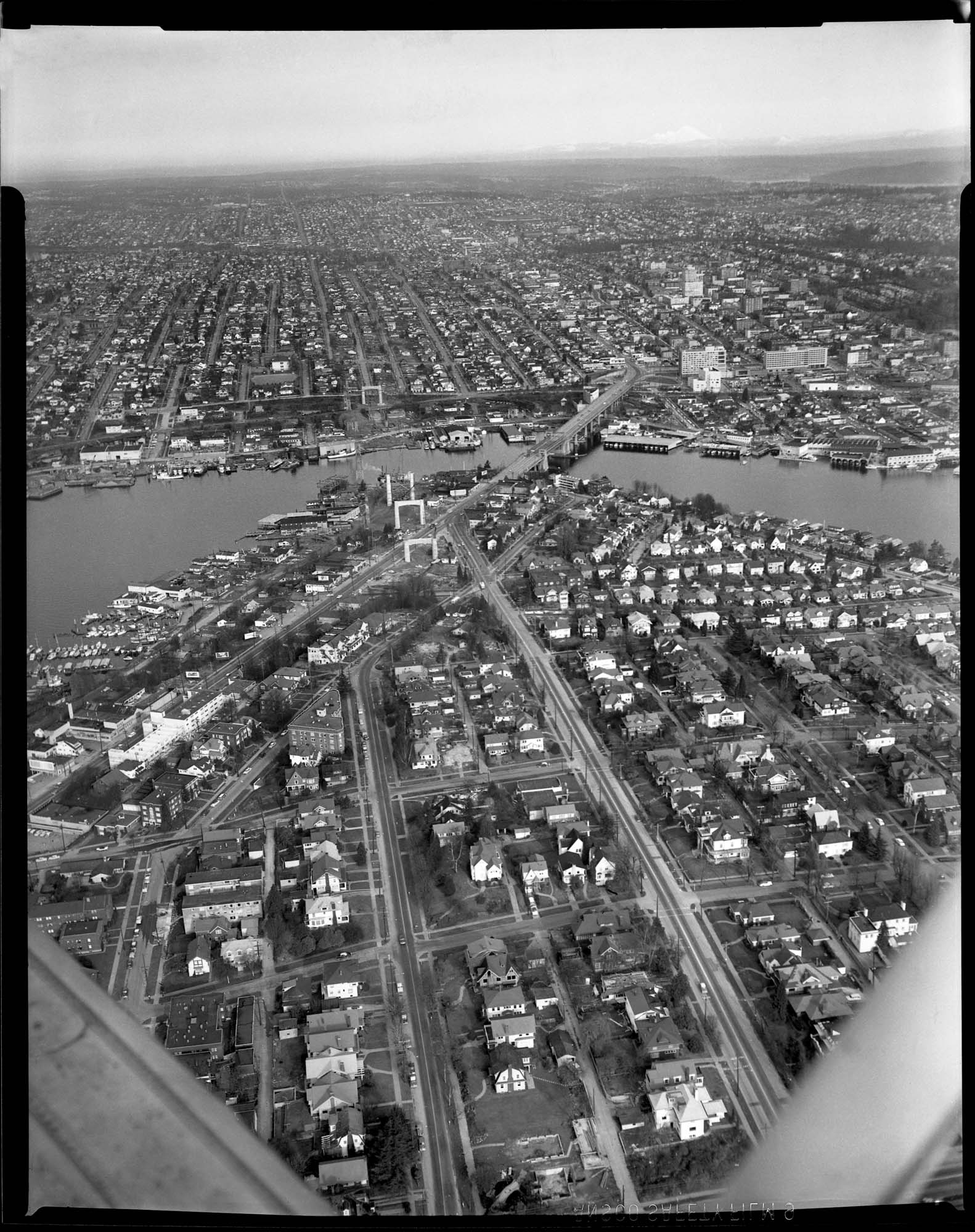 Image of Aerial of freeway bridge under construction, Seattle, 1959