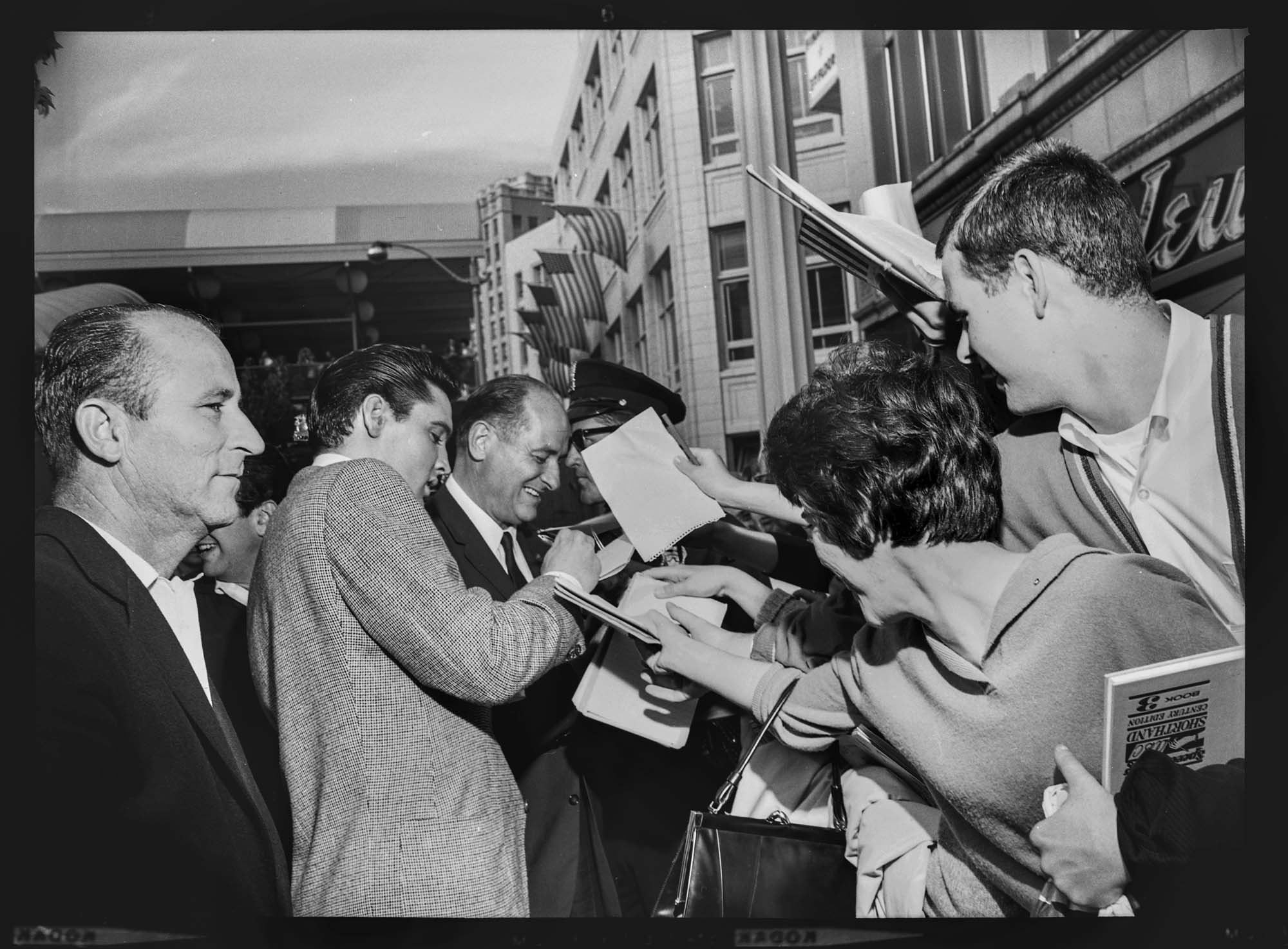 Image of Elvis Presley and Governor Rosellini signing autographs, Seattle, September 5, 1962