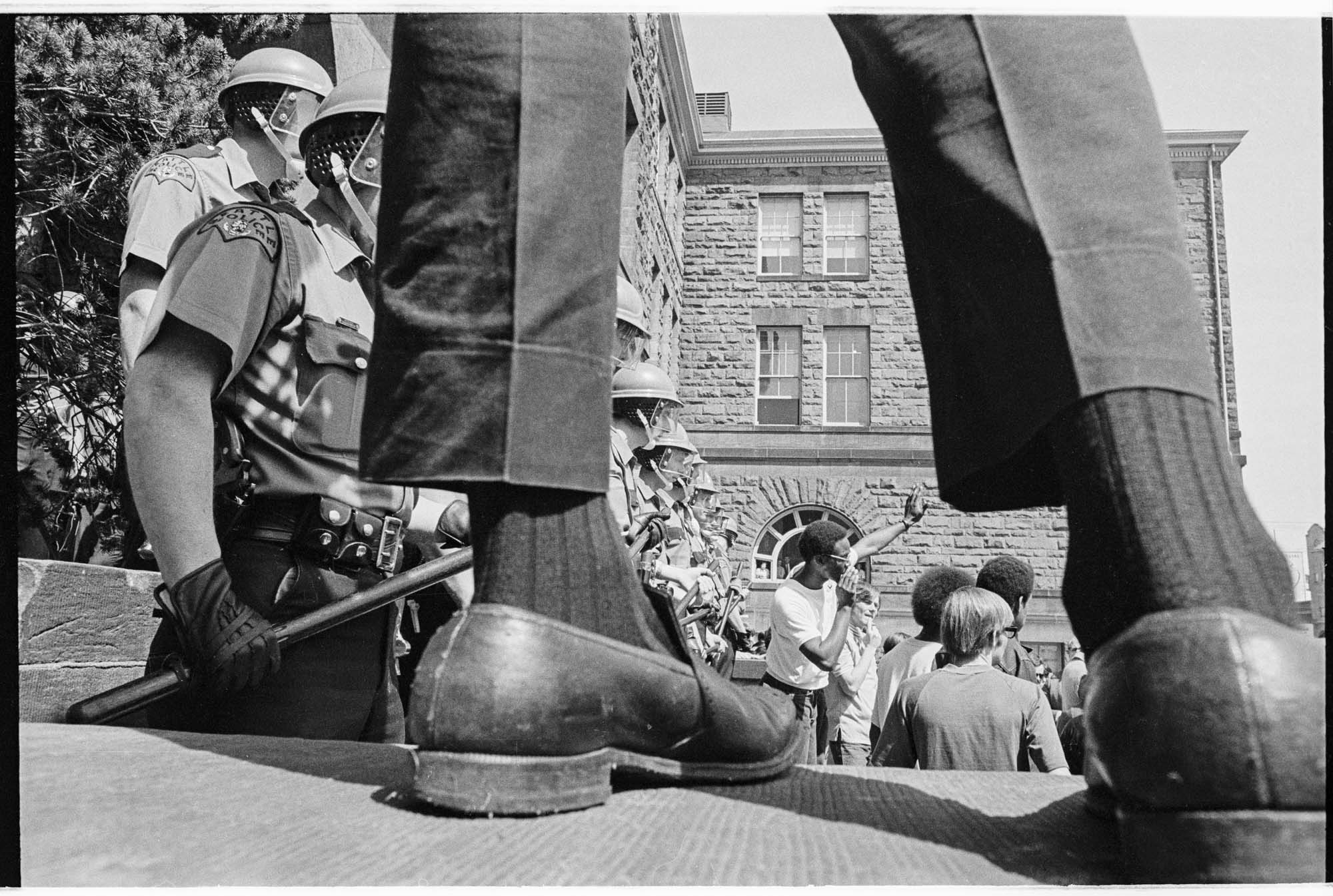 Image of Police watching Black Student Union (BSU) and Students for a Democratic Society (SDS) protest on Seattle Community College's Edison campus, Seattle, 1969