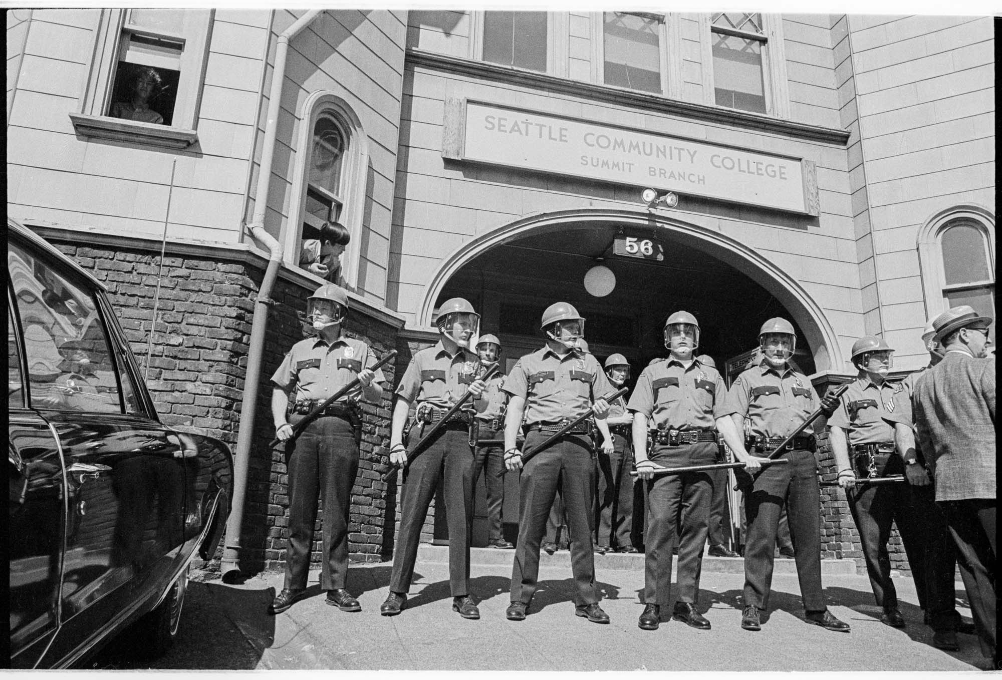 Image of Police guarding building during Black Student Union (BSU) and Students for a Democratic Society (SDS) protest on Seattle Community College's Summit campus, Seattle, 1969