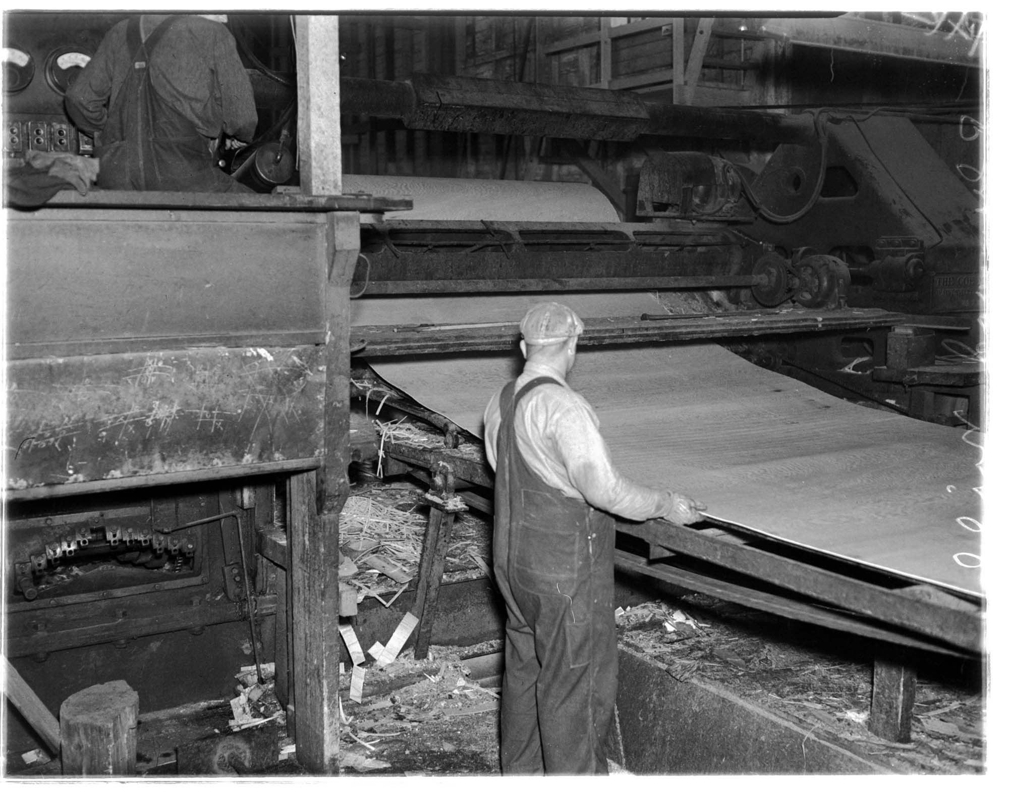 Image of Mill worker at a rolling machine in a plywood mill, July 1937