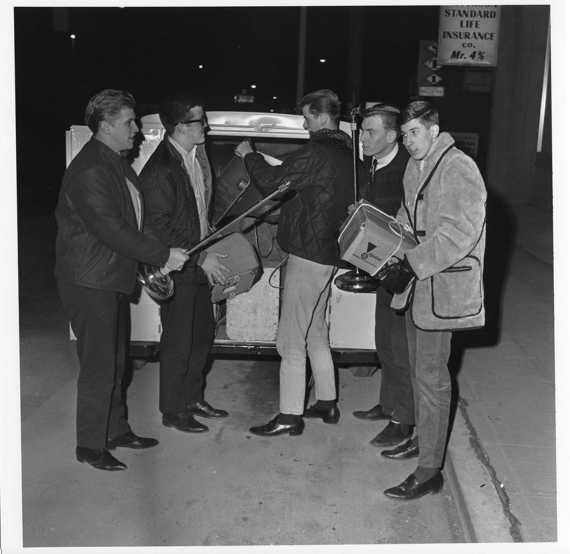 Image of The Kingsmen loading instruments into trailer, Seattle, 1964