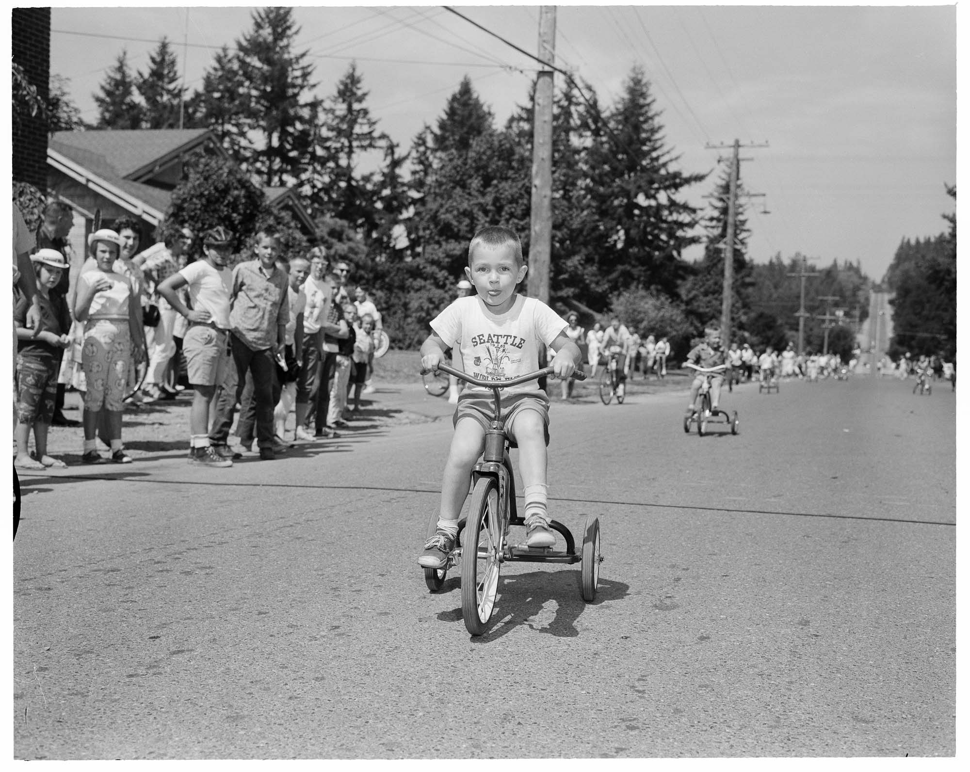 Image of Tricycle rider in the Bicycle Derby, Redmond, August 17, 1963
