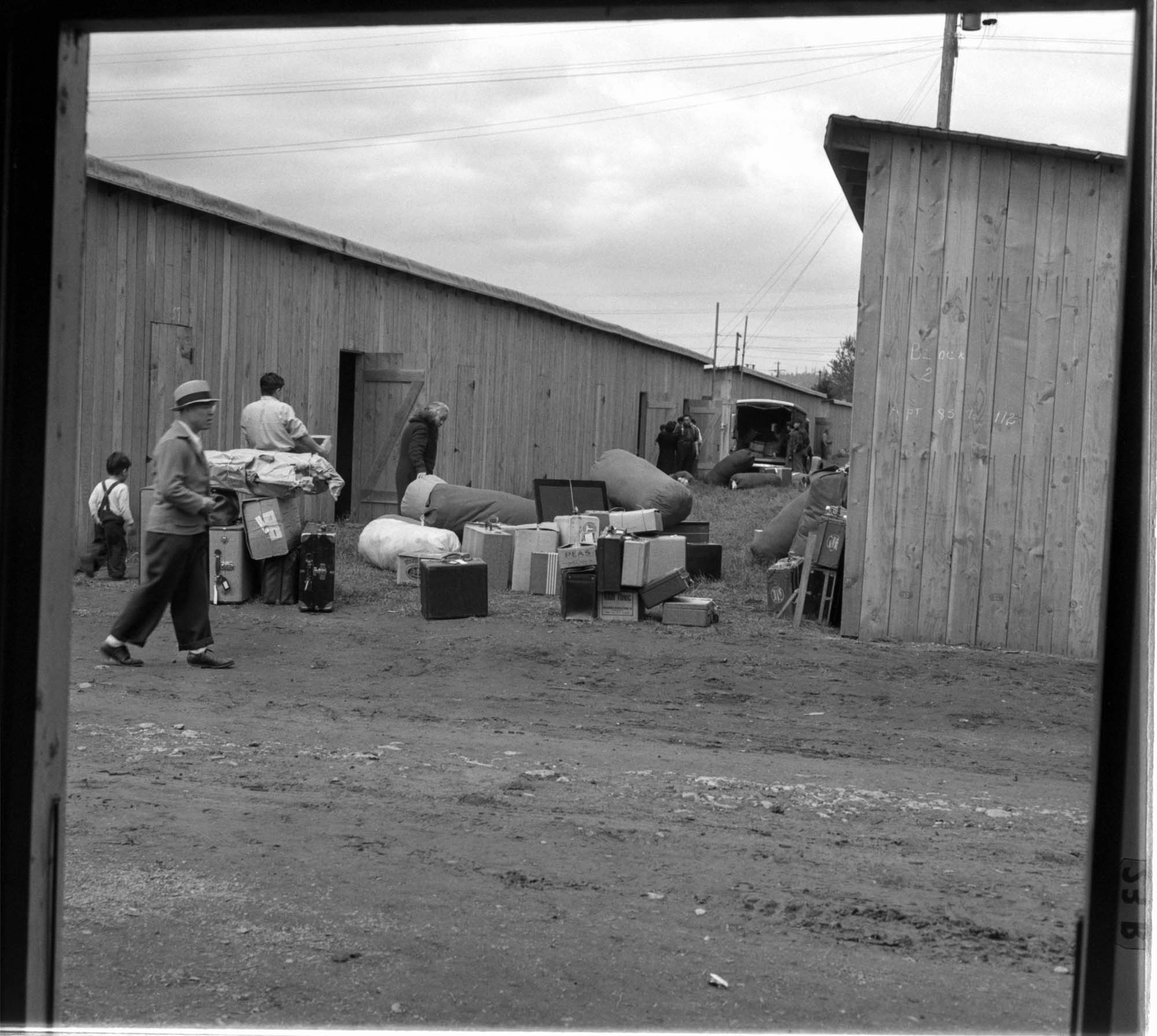 Image of Incarcerees moving into barracks at the Puyallup Assembly Center, Puyallup, 1942