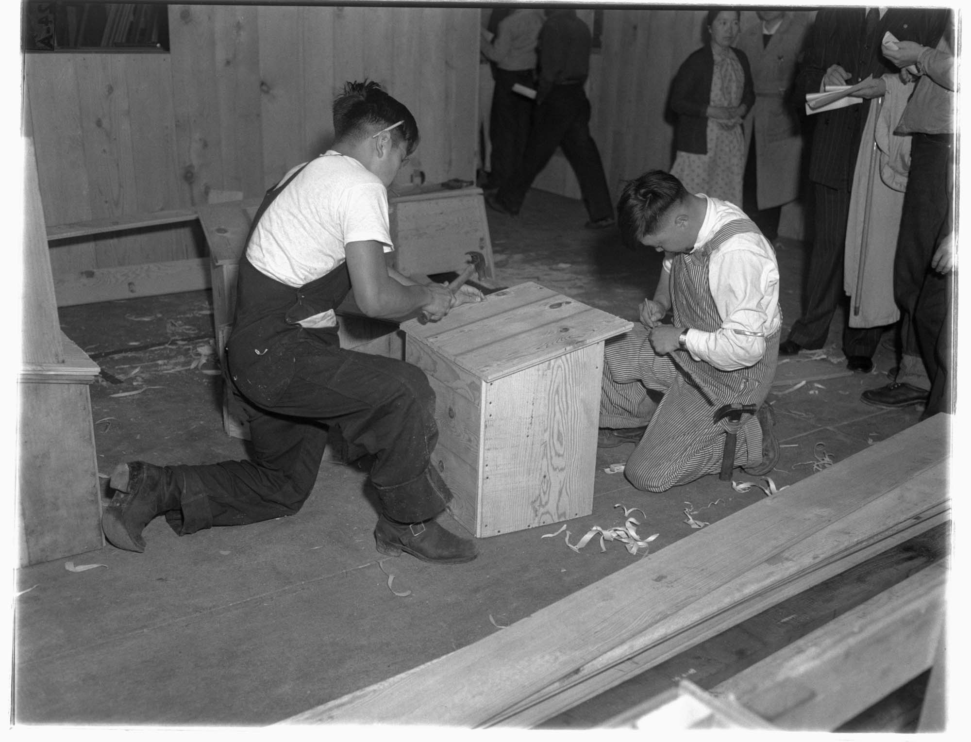 Image of Two Japanese American incarcerees doing carpentry work at the Puyallup Assembly Center, Puyallup, 1942