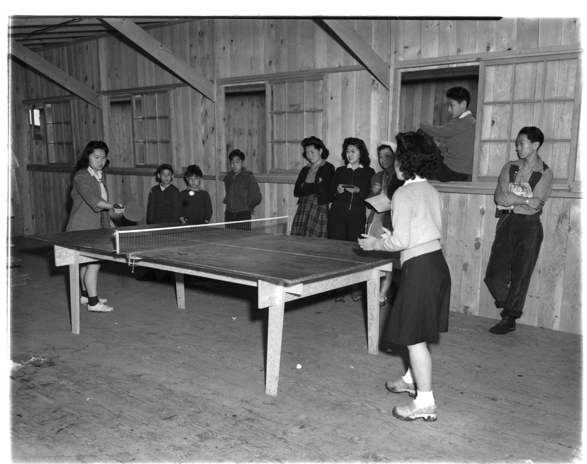 Image of Incarcerees playing table tennis at the Puyallup Assembly Center, Puyallup, 1942