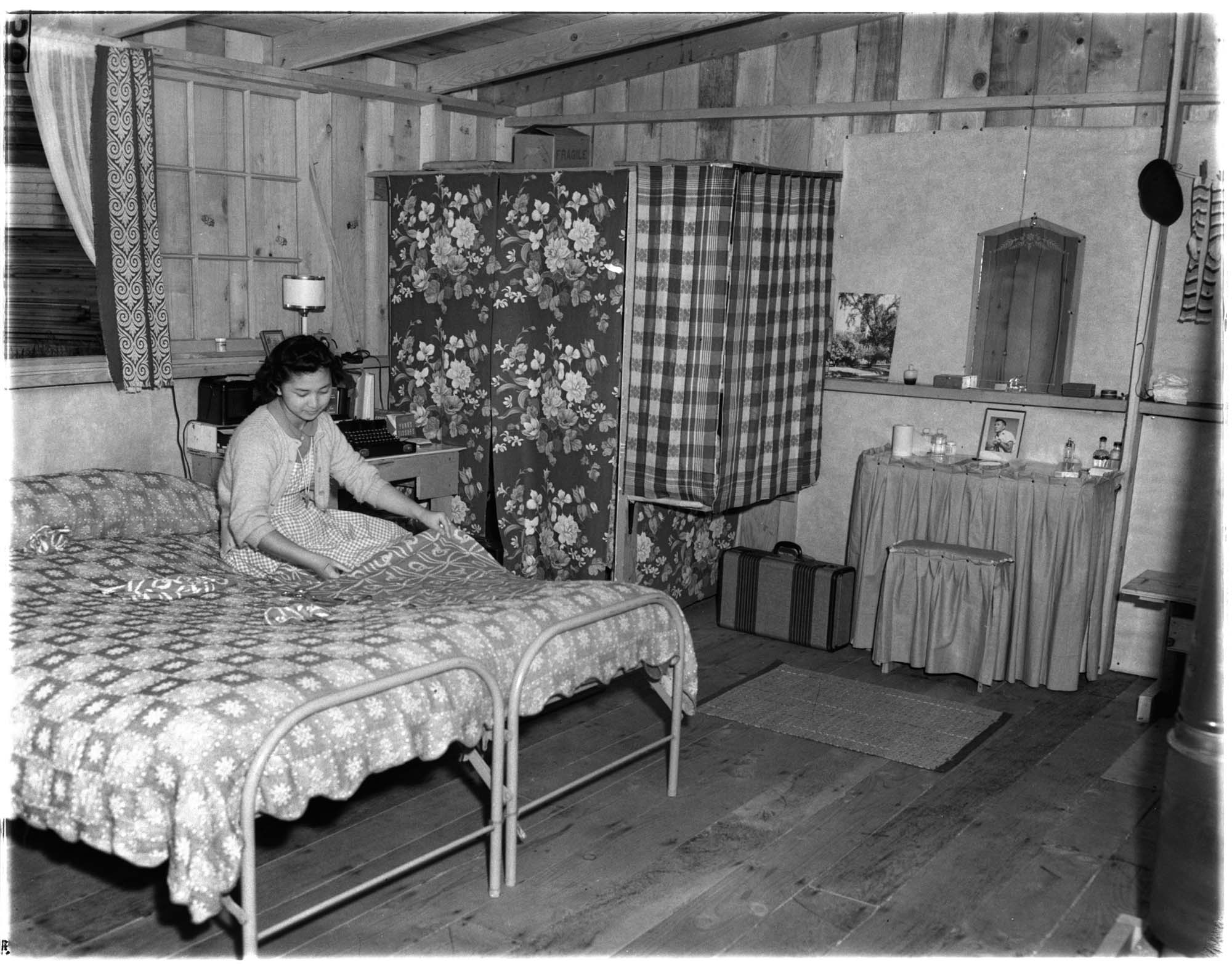 Image of Incarceree Yoshi Hosokawa in her Puyallup Assembly Center barracks living area, Puyallup, 1942
