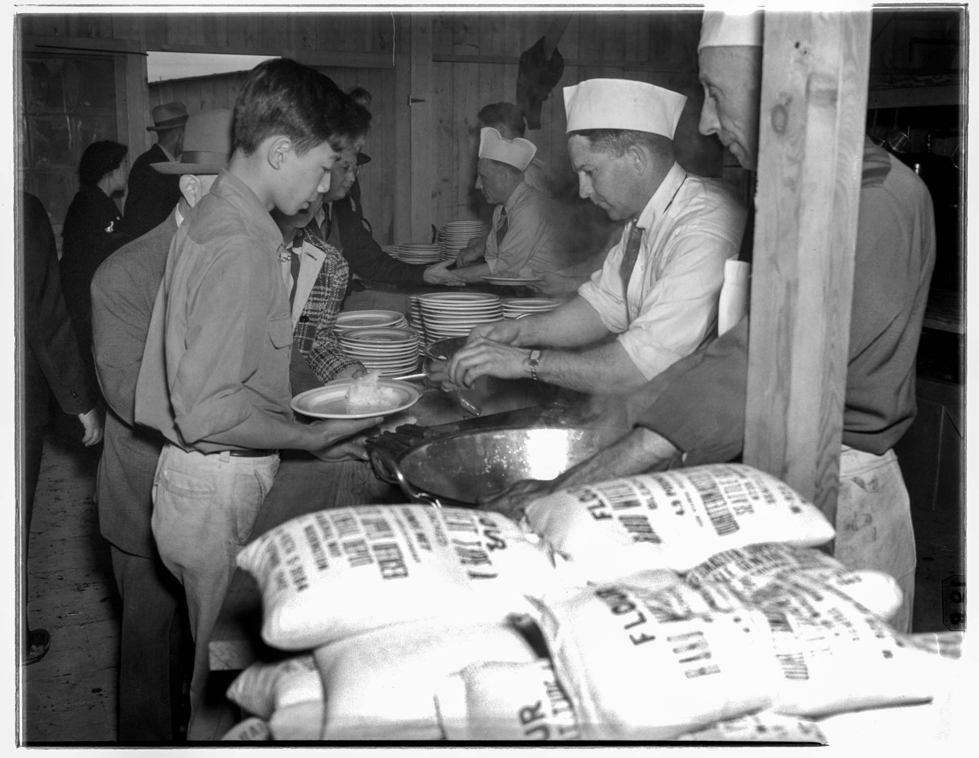 Image of Incarcerees in food line at the Puyallup Assembly Center, Puyallup, 1942