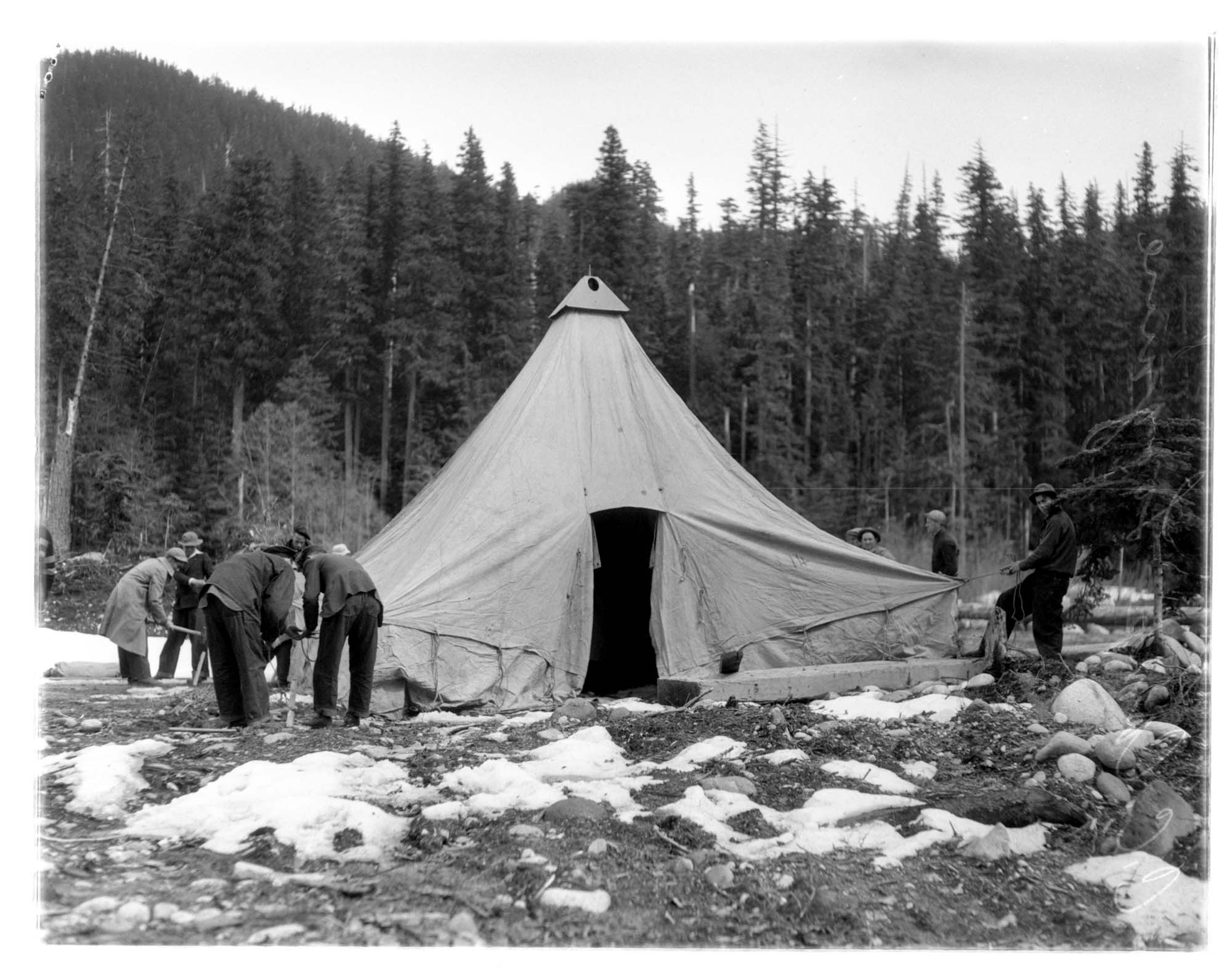 Image of Men setting up tent at campsite, Civilian Conservation Corps, Longmire, circa 1937