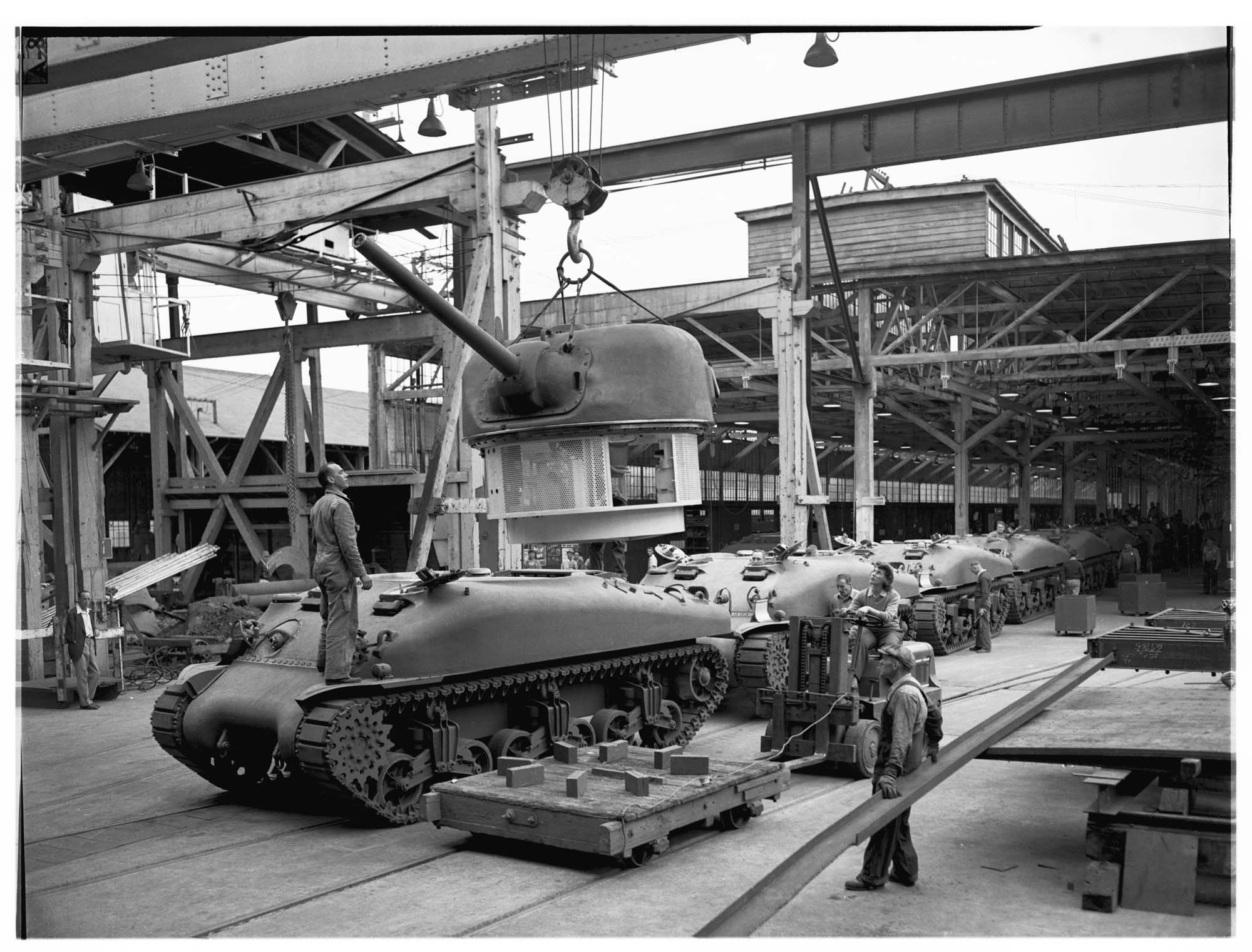 Image of Tanks on assembly line at Pacific Car and Foundry  factory, Renton, 1943