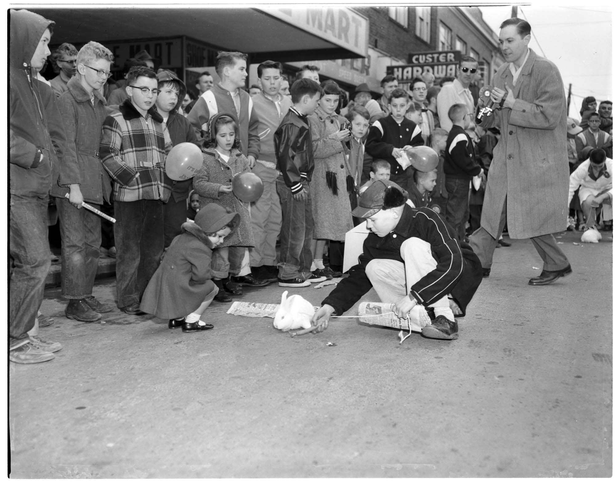 Image of Children and a rabbit at the Renton Rabbit Race, March 23, 1956