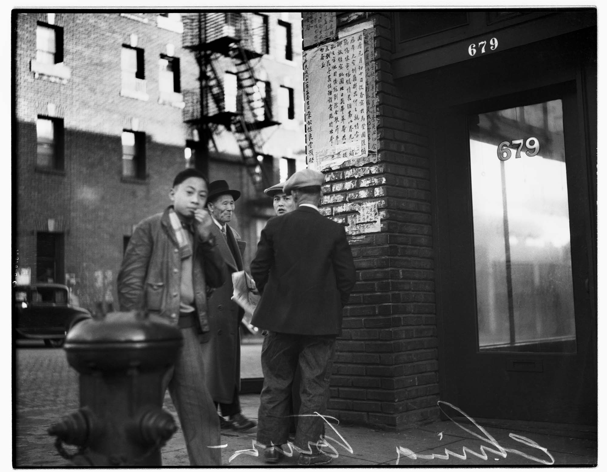 Image of Men on a corner in Seattle's Chinatown, 1932