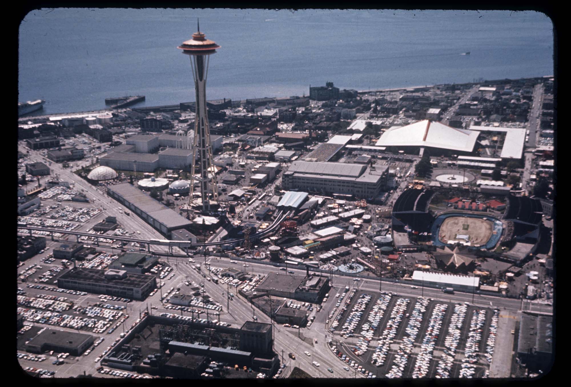 Image of Aerial view, looking west, of the Space Needle and Seattle World's Fair grounds with Elliott Bay, 1962