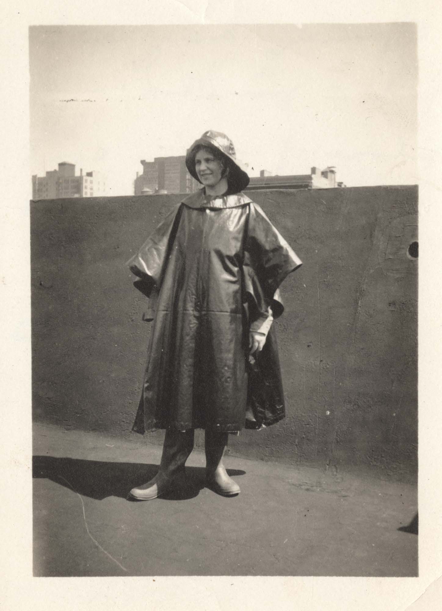 Image of Abbie Ewart in nurse's rain outfit on the roof of the Irving Hotel, New York, May 1918