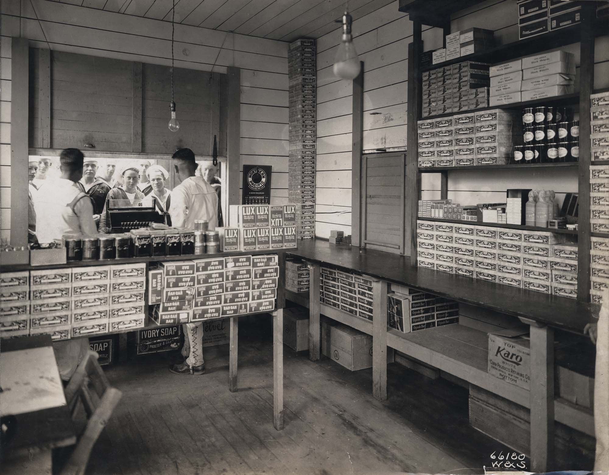 Image of Naval cadets at store window of the U.S. Naval Training Station, University of Washington, September 1918