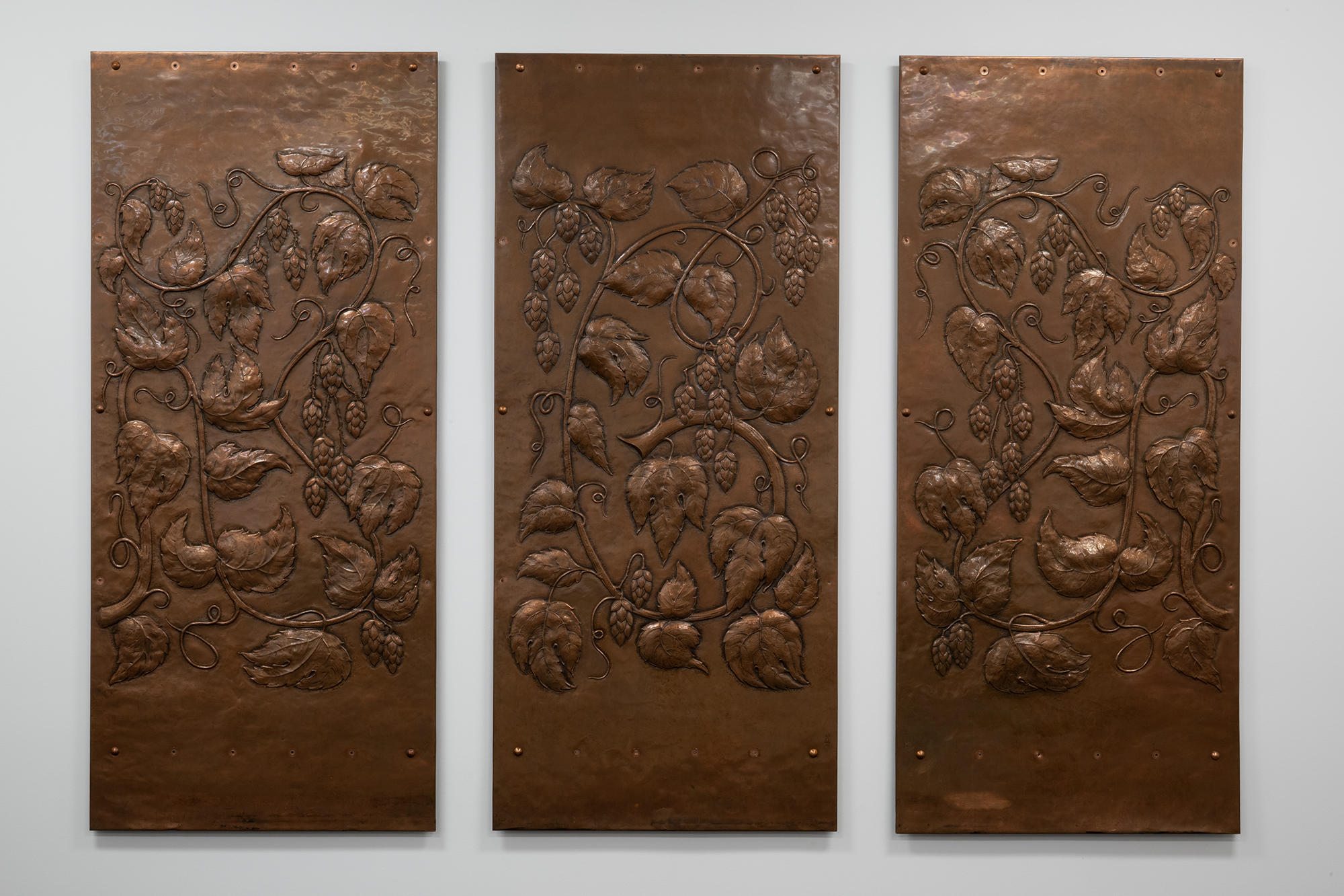 Image of Three copper panels from the Mountain Room at the Rainier Beer Brewery, 1948