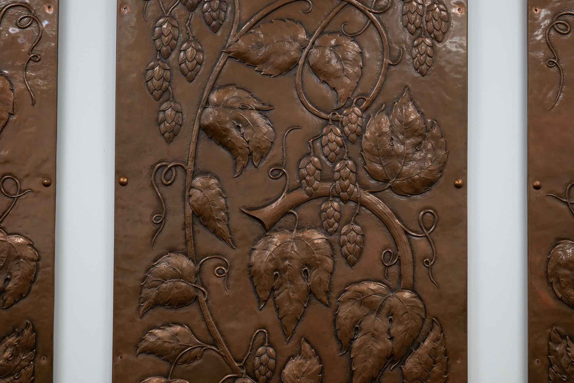 Image of Three copper panels from the Mountain Room at the Rainier Beer Brewery, 1948