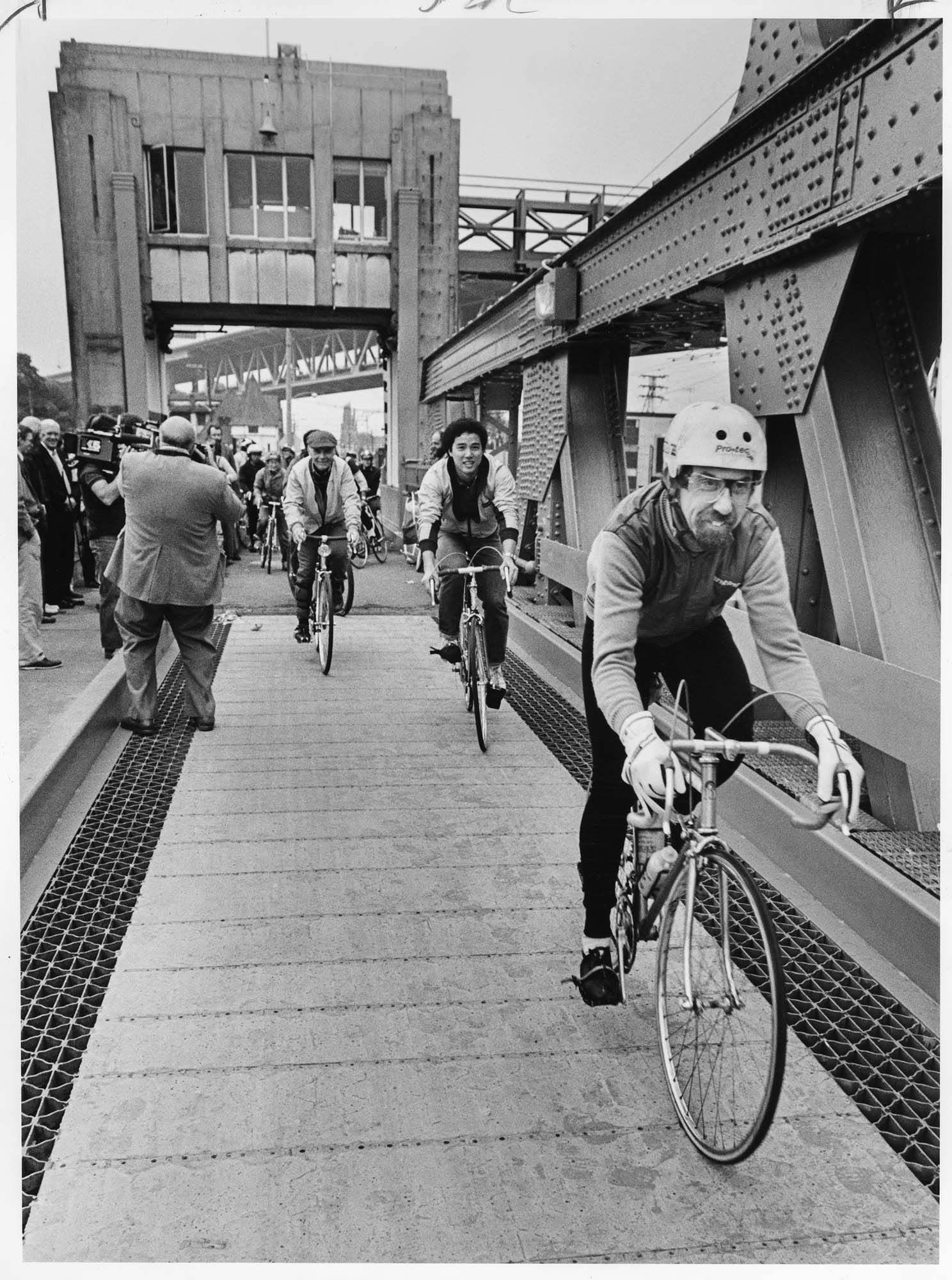 Image of Bicyclists riding on the newly finished bicycle lanes of the University Bridge, Seattle, October 12, 1983
