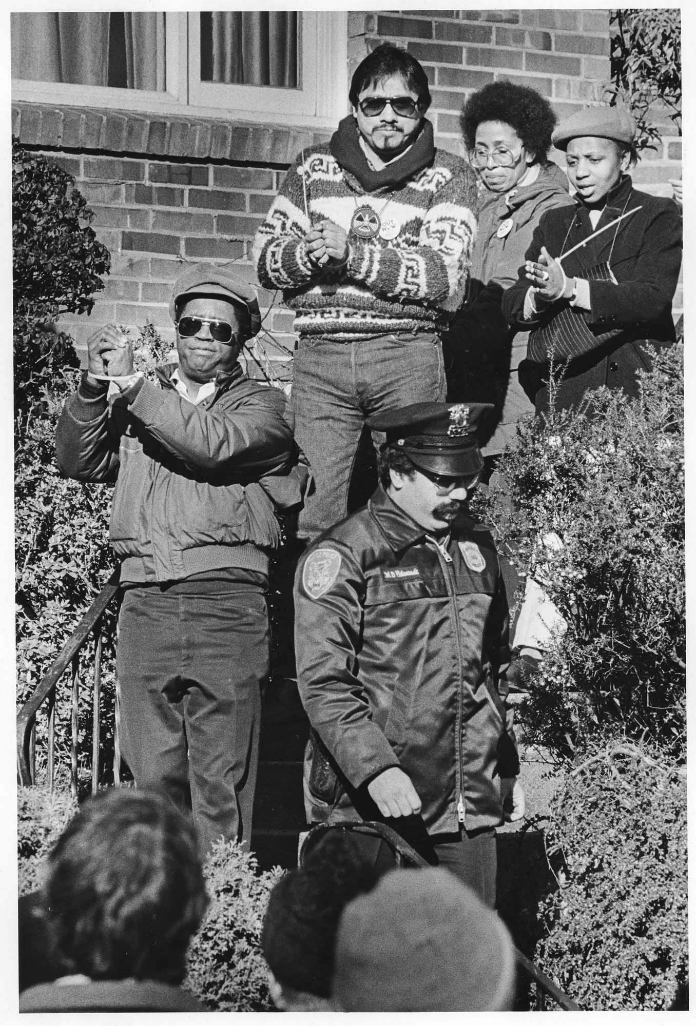 Image of Police escorting minority leaders from South African consulate, Seattle, February 3, 1985