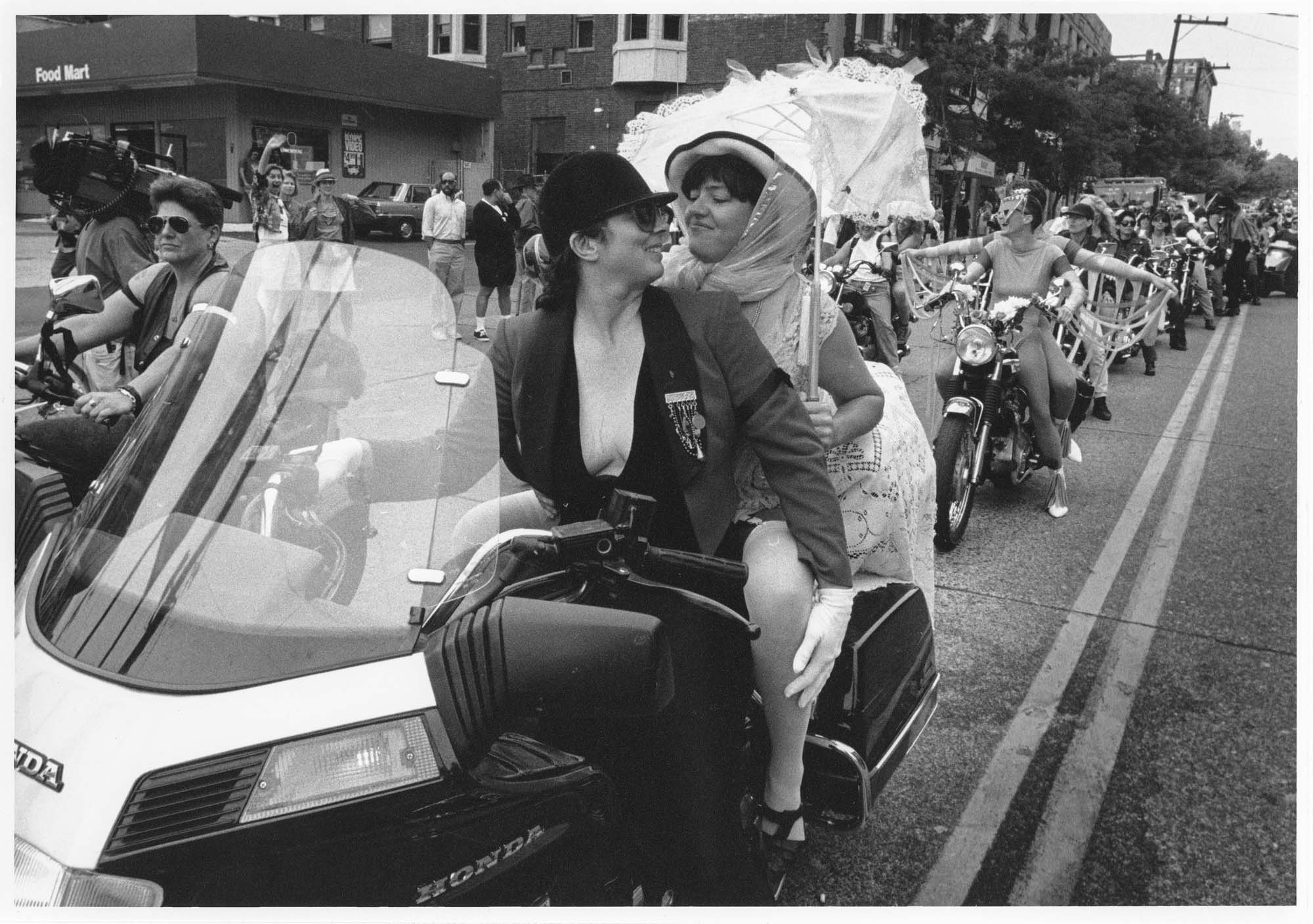 Image of Susan Benner and Michelle riding with Dykes on Bikes in the Pride Parade, Seattle, June 28, 1992