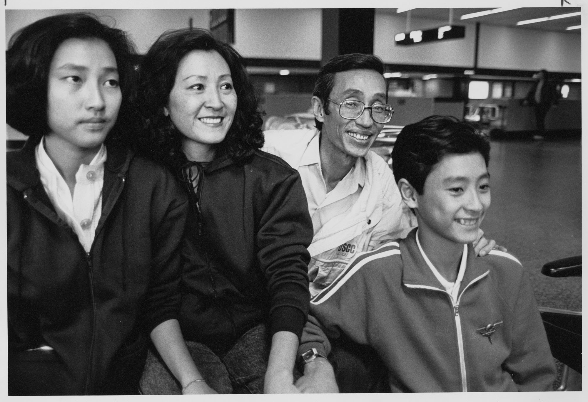 Image of Hoang Xuan Thuy and family at Sea-Tac Airport, January 17, 1990