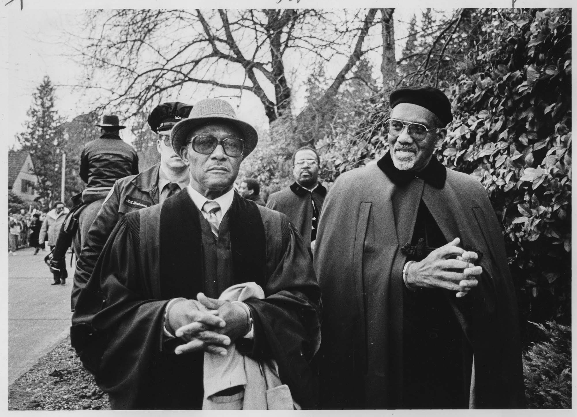 Image of Rev. Leon Jones and Rev. Samuel B. McKinney arrested at protest against South Africa, Seattle, December 9, 1984