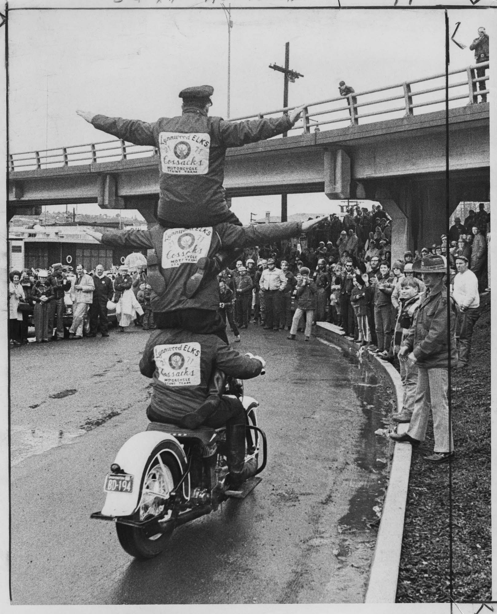 Image of Lynnwood Elks' Cossacks motorcycle stunt team nearing the Garfield Street Bridge, Seattle, February 13, 1972