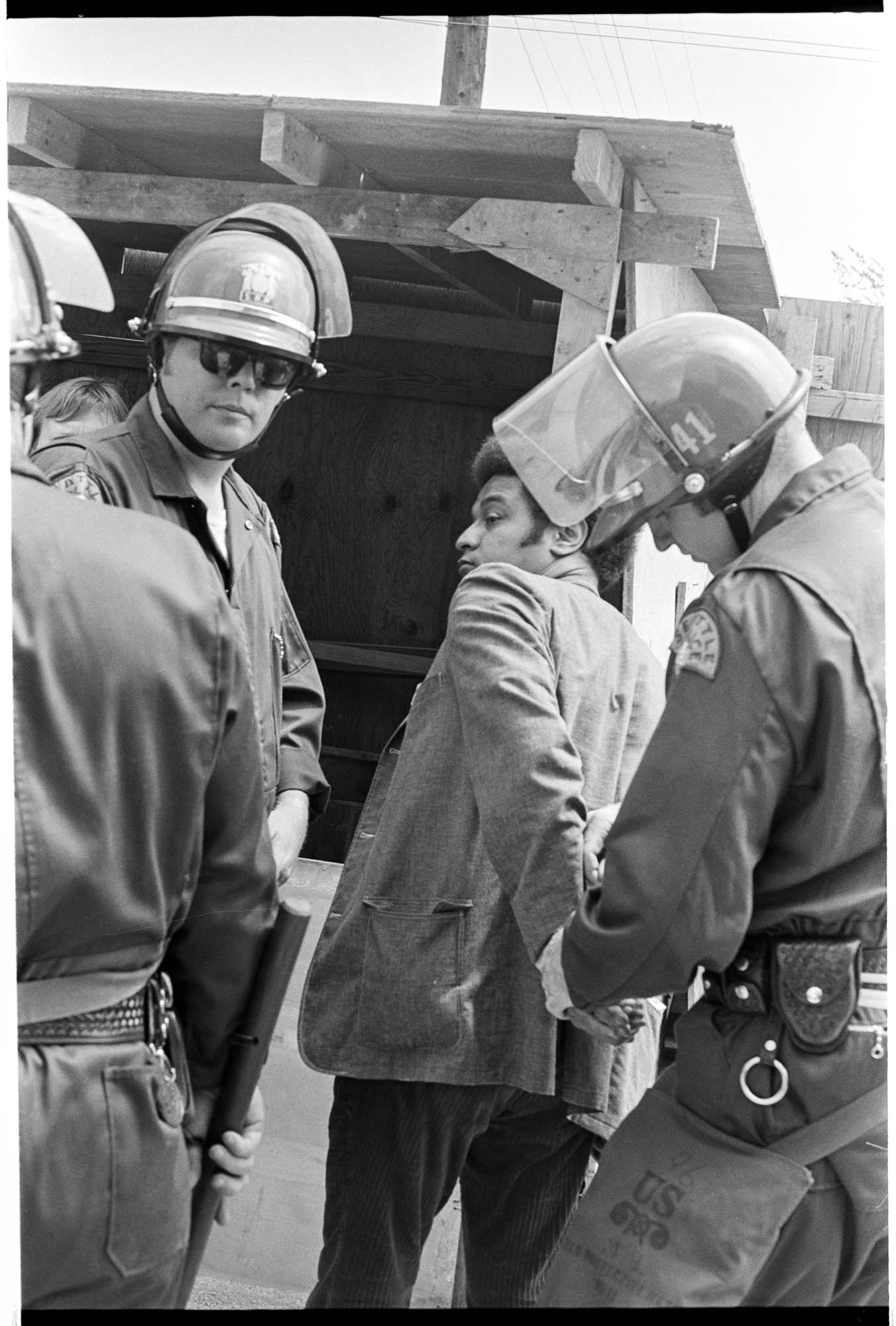 Image of State Representative Mike Ross being arrested at UCWA protest, June 7, 1972