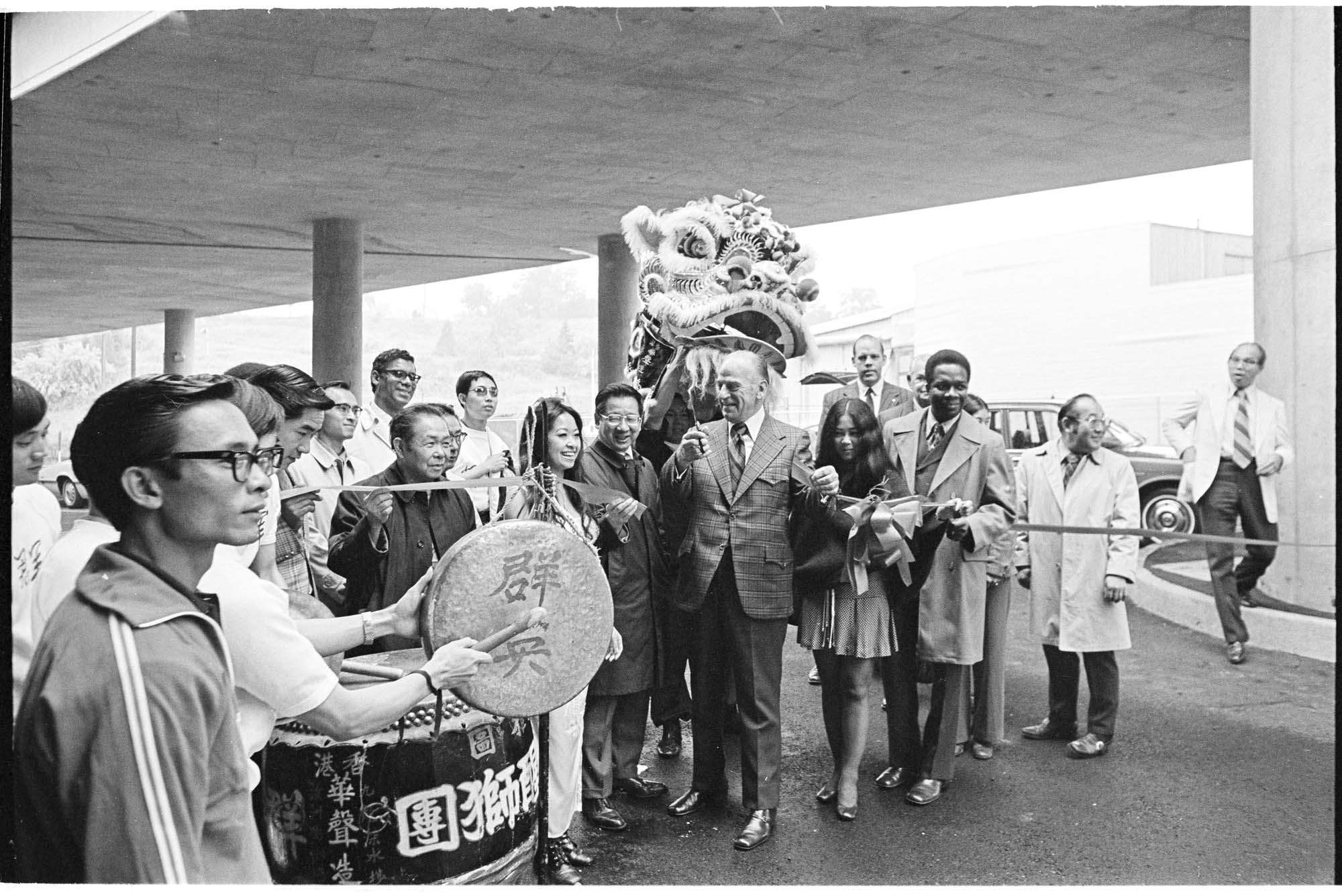 Image of John Cherberg cutting ribbon to open new parking lot on King Street, Seattle, June 14, 1972