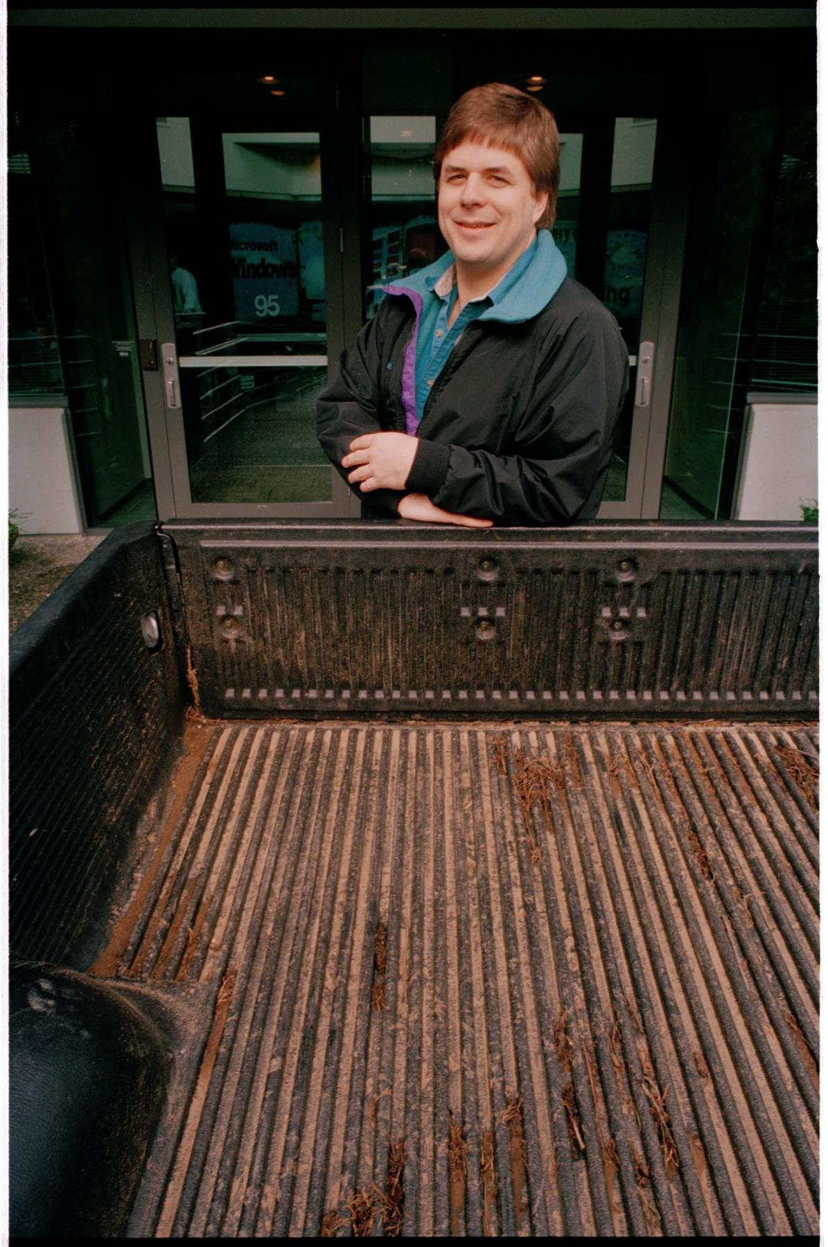 Image of David Cole of Microsoft with pickup truck, Redmond, February 15, 1995