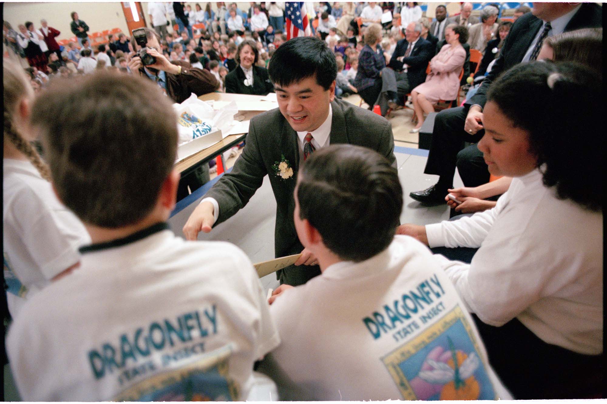 Image of Gary Locke signing bill to make the dragonfly the state insect, April 10, 1997