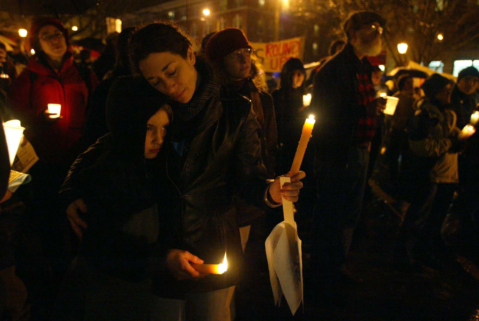 Image of Madeleine Sosin and Jonah Cohen protest new INS policies at Hing Hay Park, Seattle, January 13, 2003