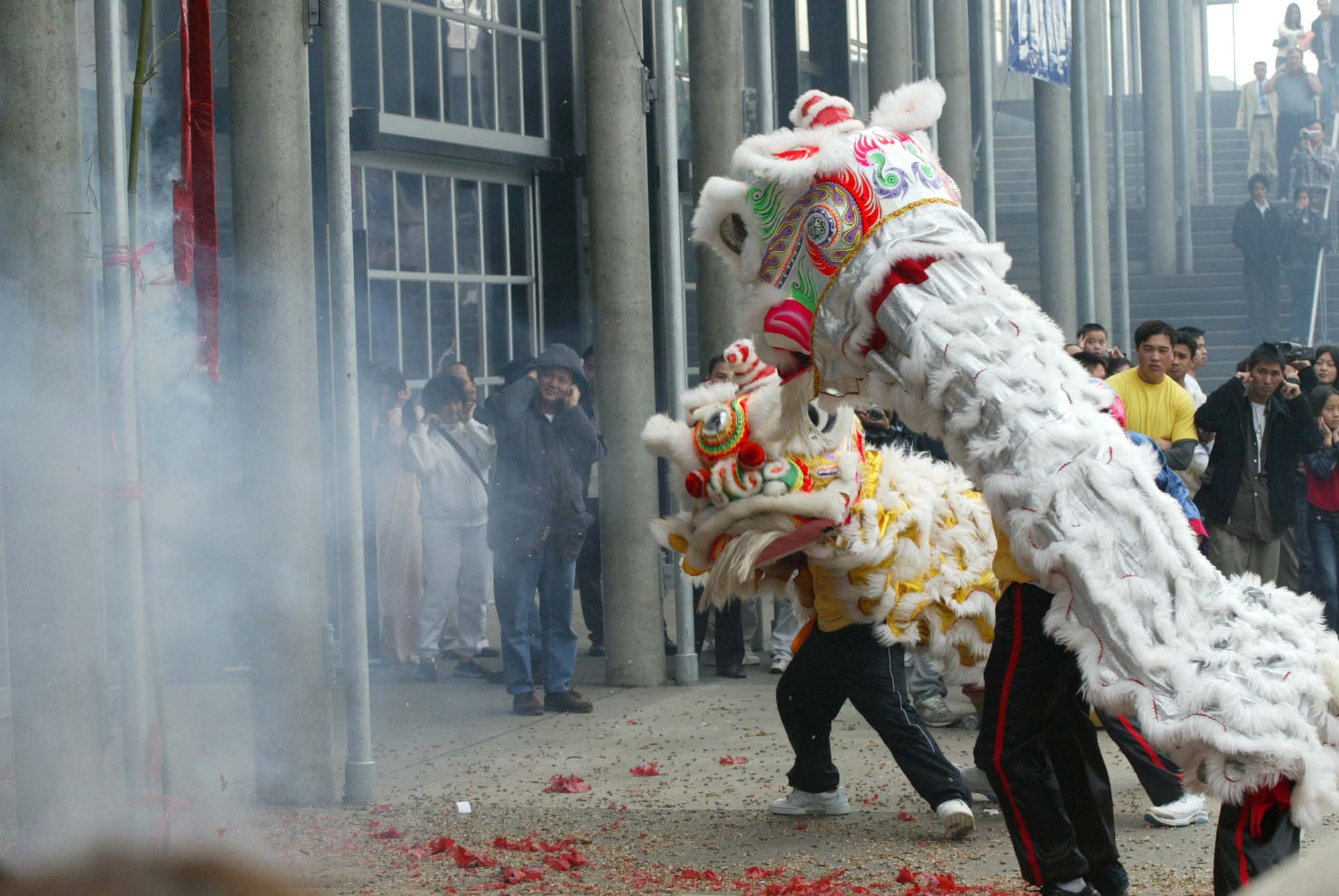 Image of Spectators watch Lion Dance performers during Tet festival at Seattle Center, January 25, 2003