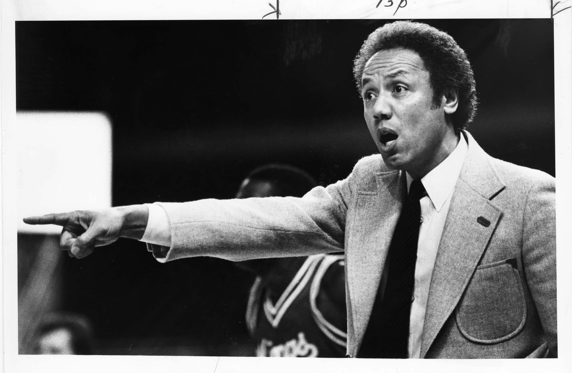 Image of Lenny Wilkens coaching from sideline of Sonics game, Seattle, December 1982