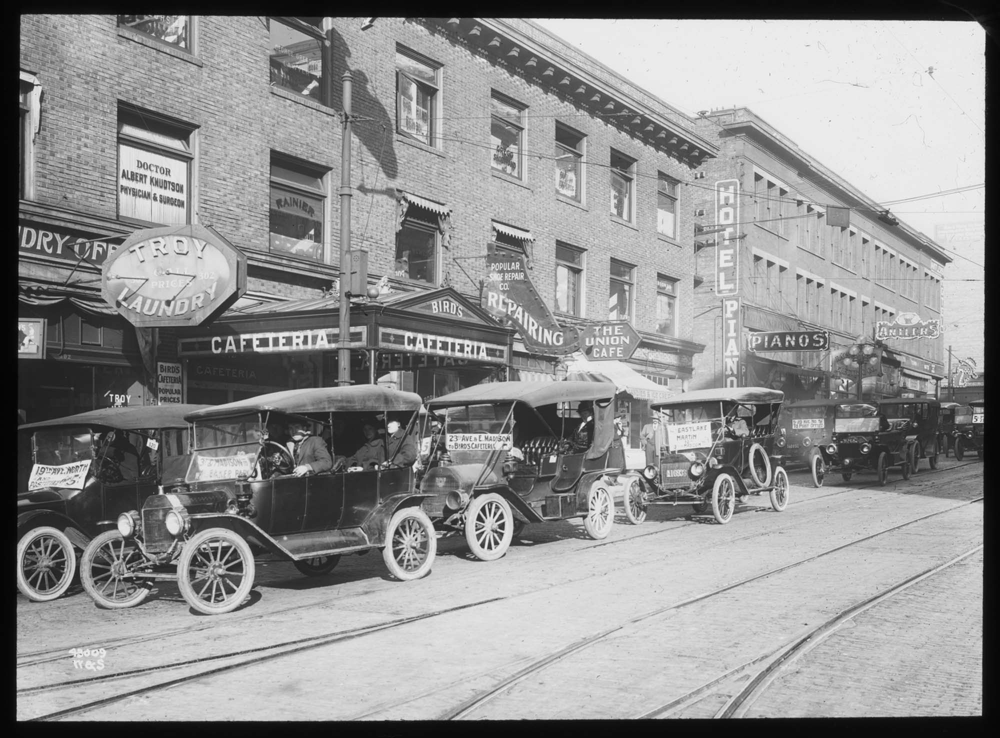 Image of Jitney buses lined up on street, Seattle, 1918