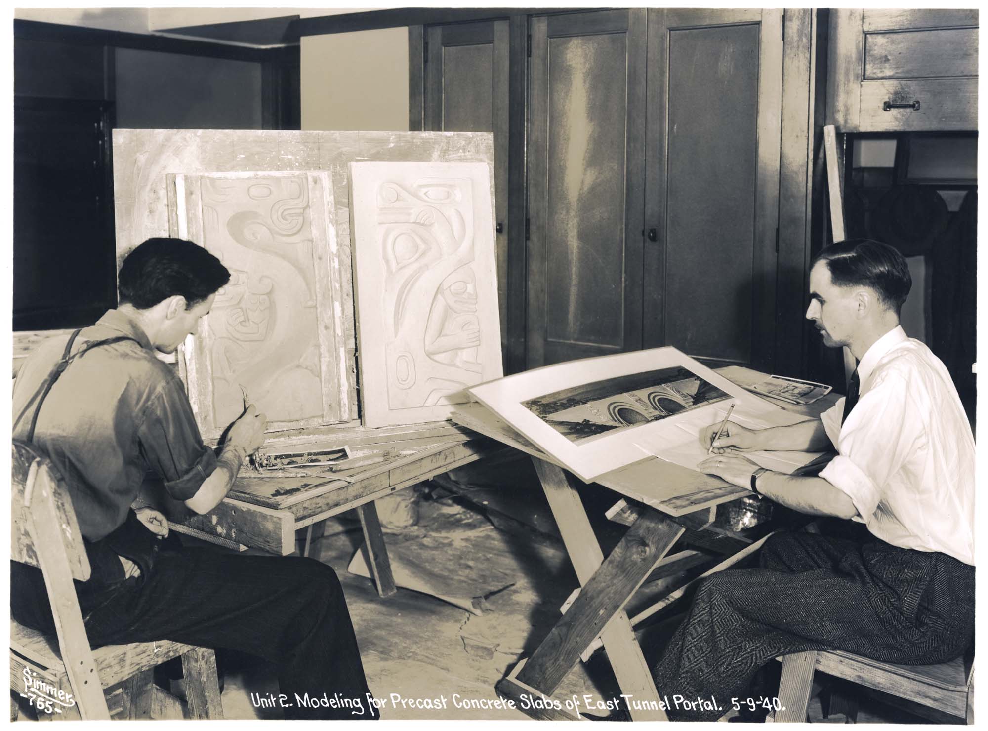 Image of James Fitzgerald and Lloyd Lovegren working on the East Tunnel Portal models for the Lake Washington Floating Bridge, May 9, 1940