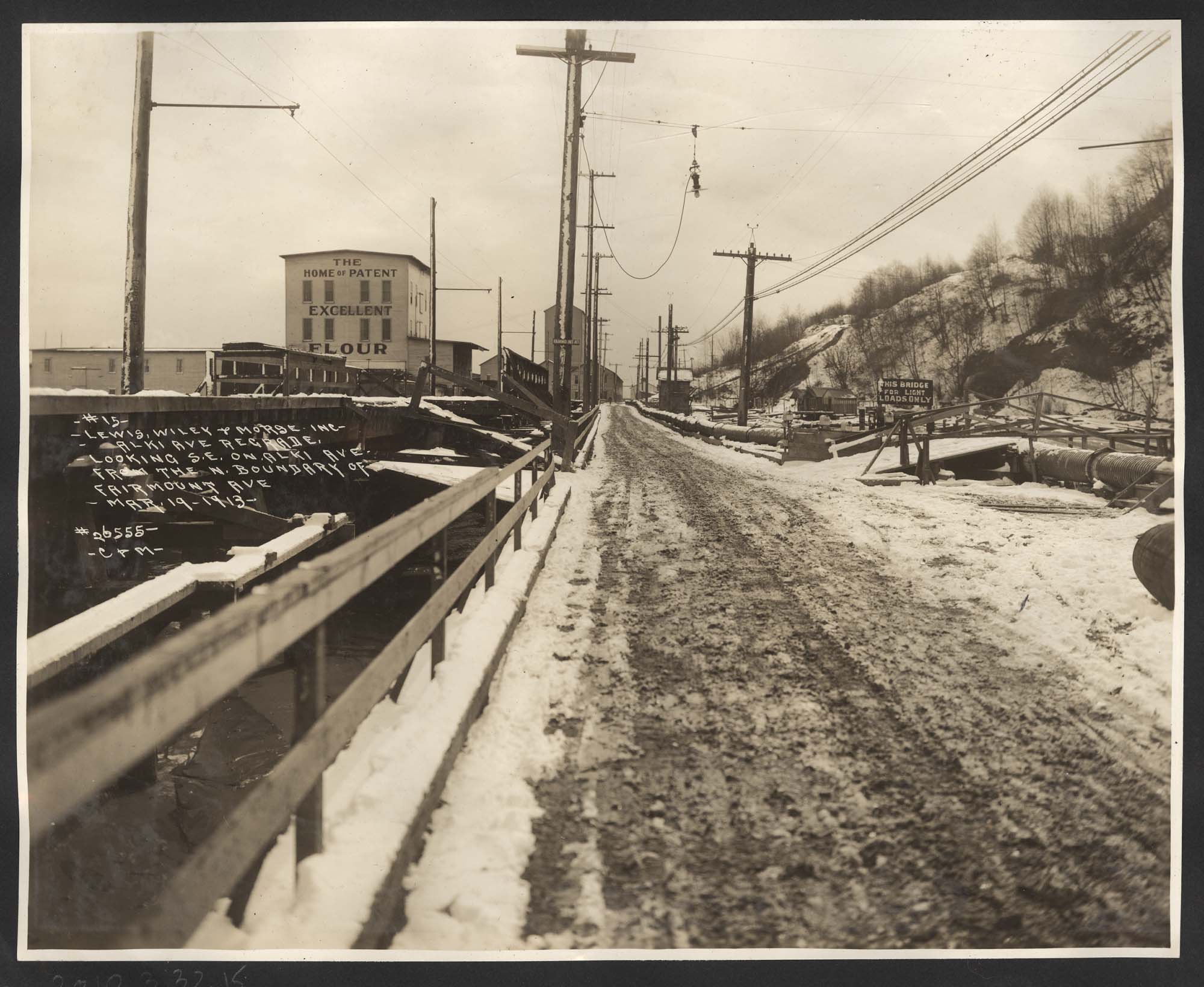 Image of View of street and flour mill, looking southeast on Alki Avenue, March 19, 1913