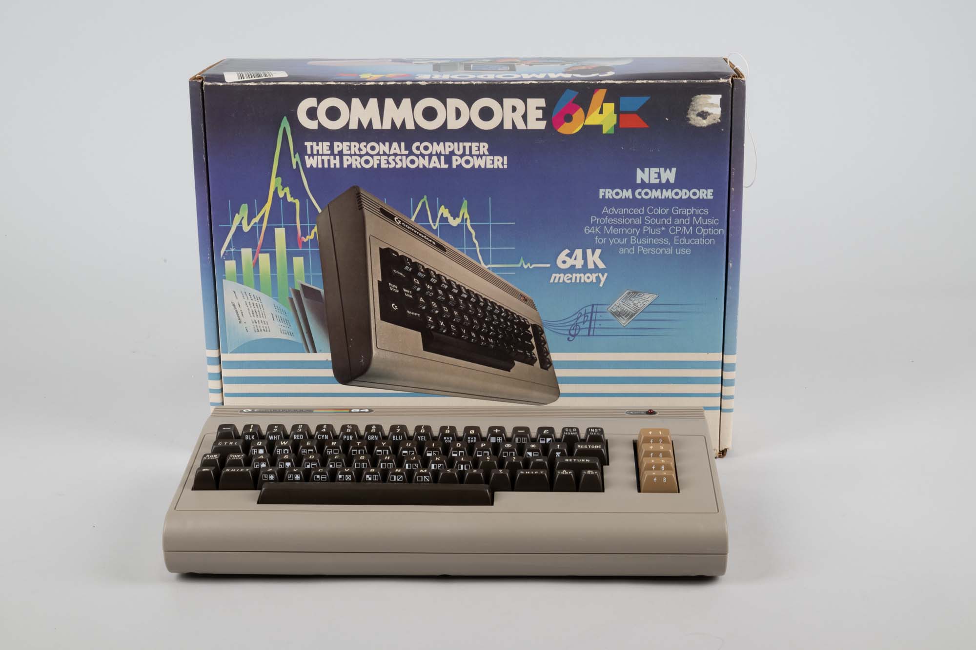 Image of Commodore 64 computer, with manuals and accessories, ca. 1982