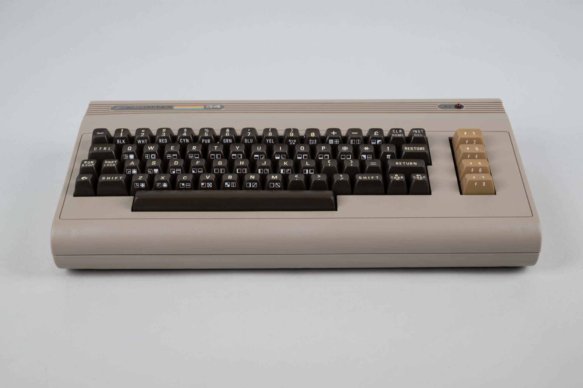 Image of Commodore 64 computer, with manuals and accessories, ca. 1982
