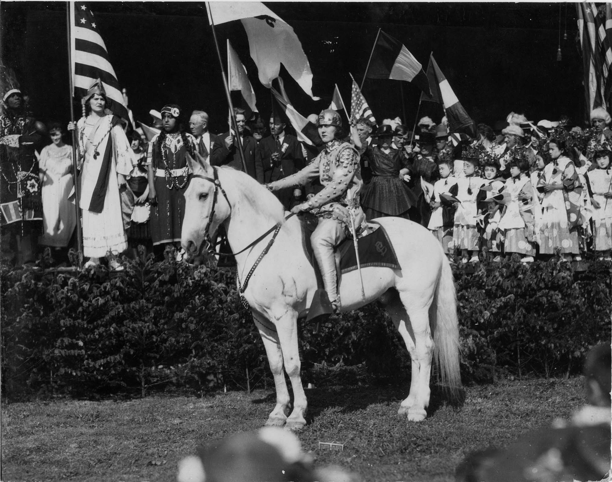 Image of Woman on horseback dressed as Joan of Arc at Seattle's Independence Day celebration, July 5, 1920
