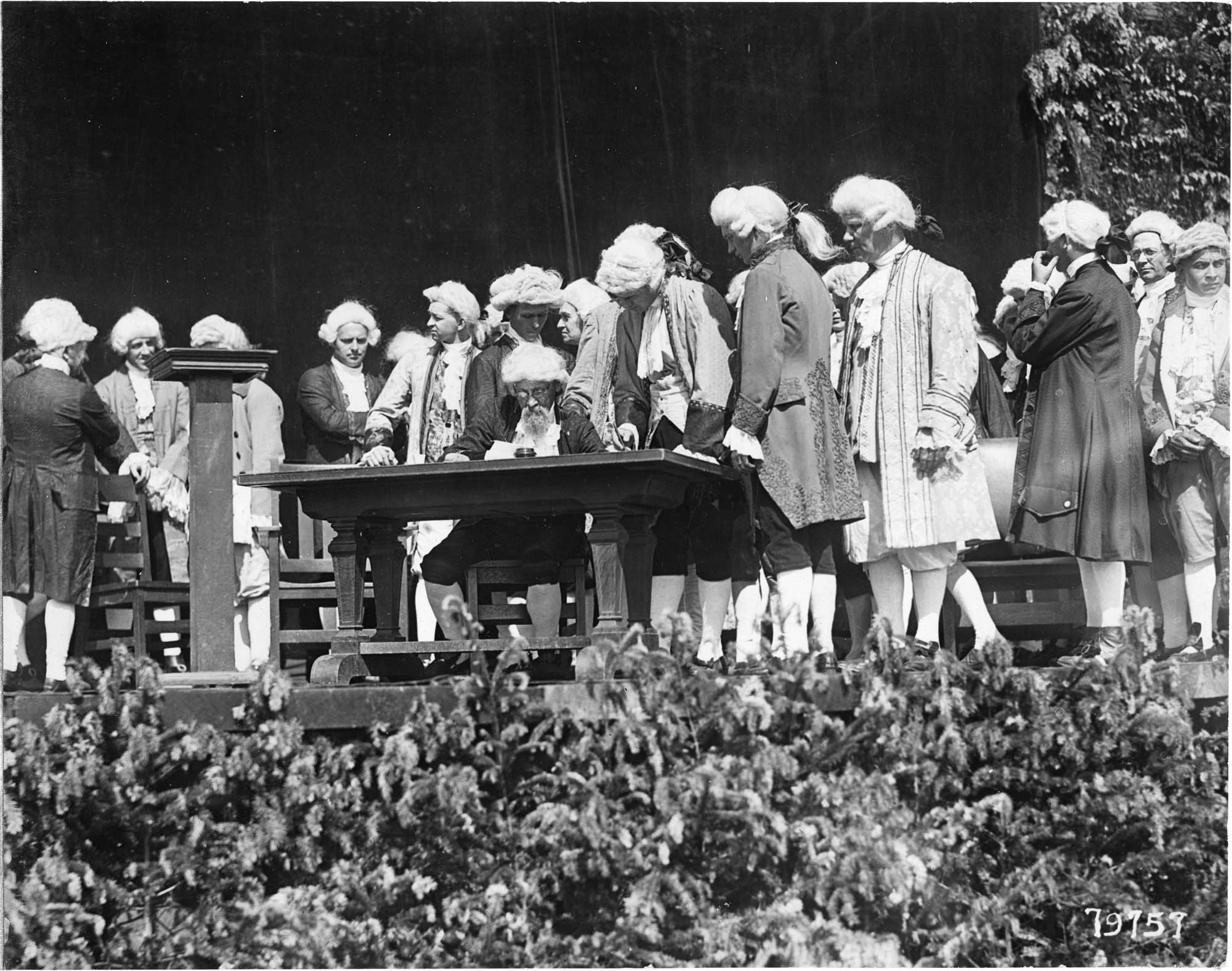 Image of Men in colonial period dress performing in the 