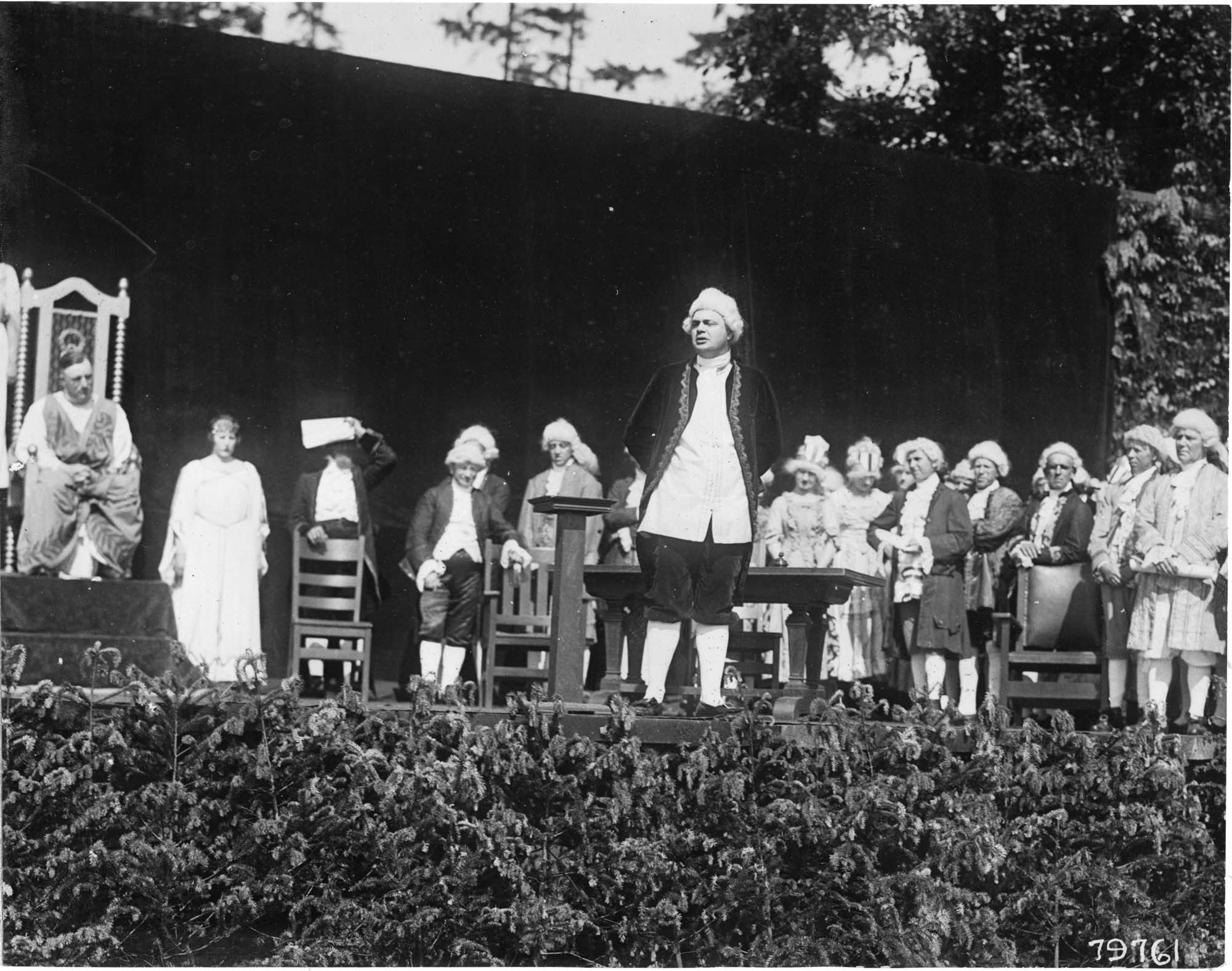 Image of Man in colonial dress and others performing in the 