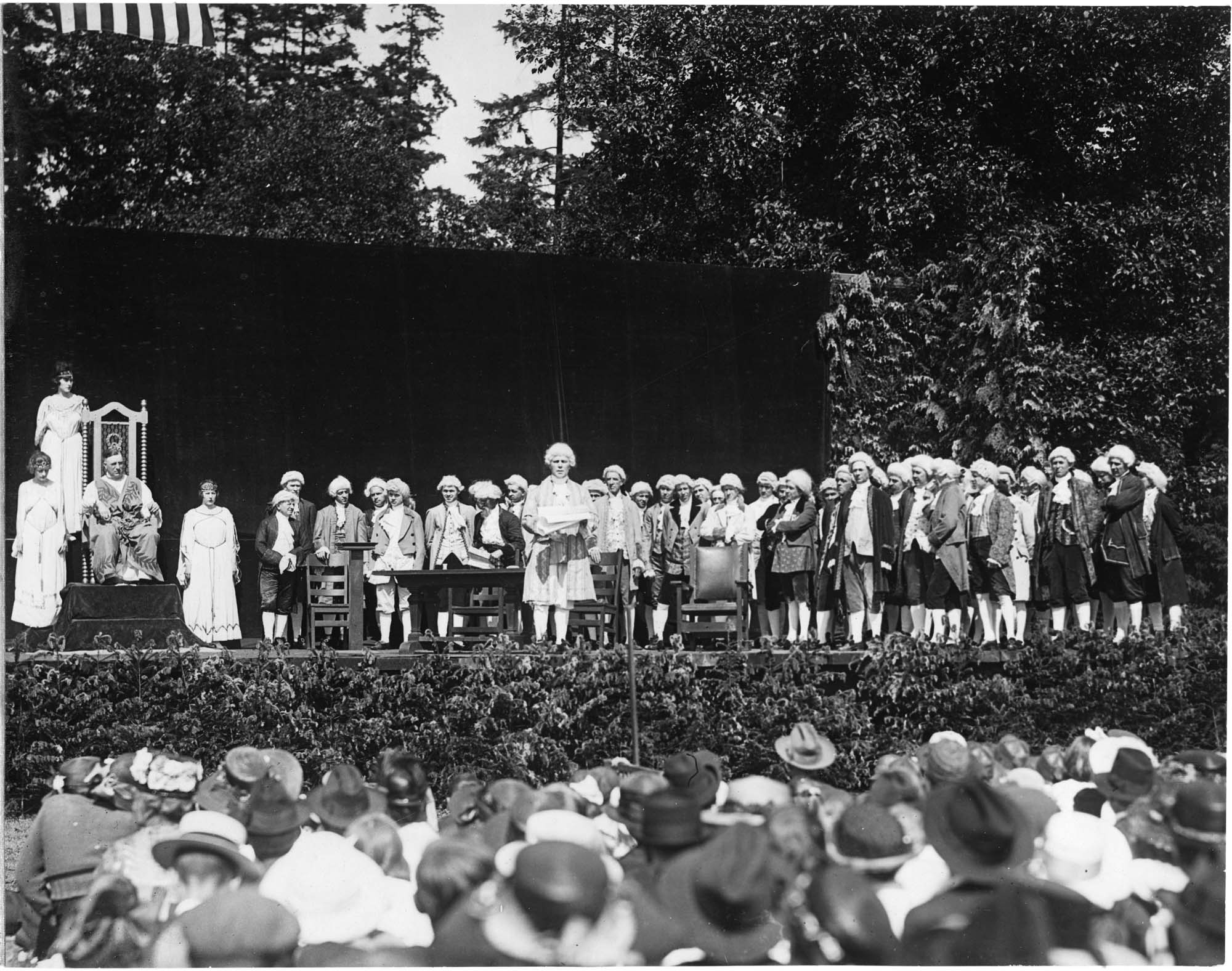 Image of Performers in colonial dress and others at the 