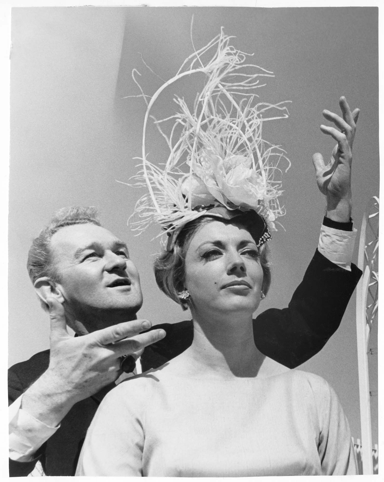 Image of Model Donna Rydberg and hat designer John Eaton, Seattle, 1962