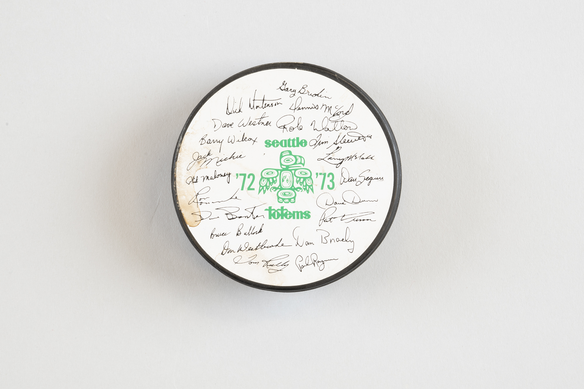 Image of Seattle Totems hockey puck with signatures of the 1972-1973 team