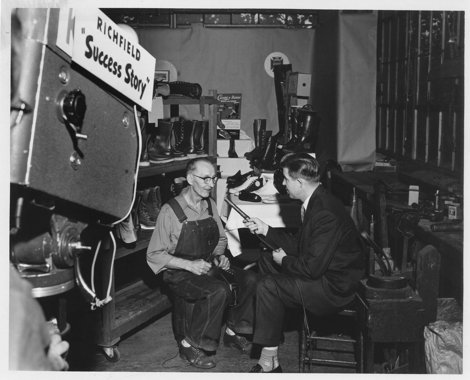 Image of Worker being interviewed for a documentary at the Currin-Greene Shoe Manufacturing Company, Seattle, 1959